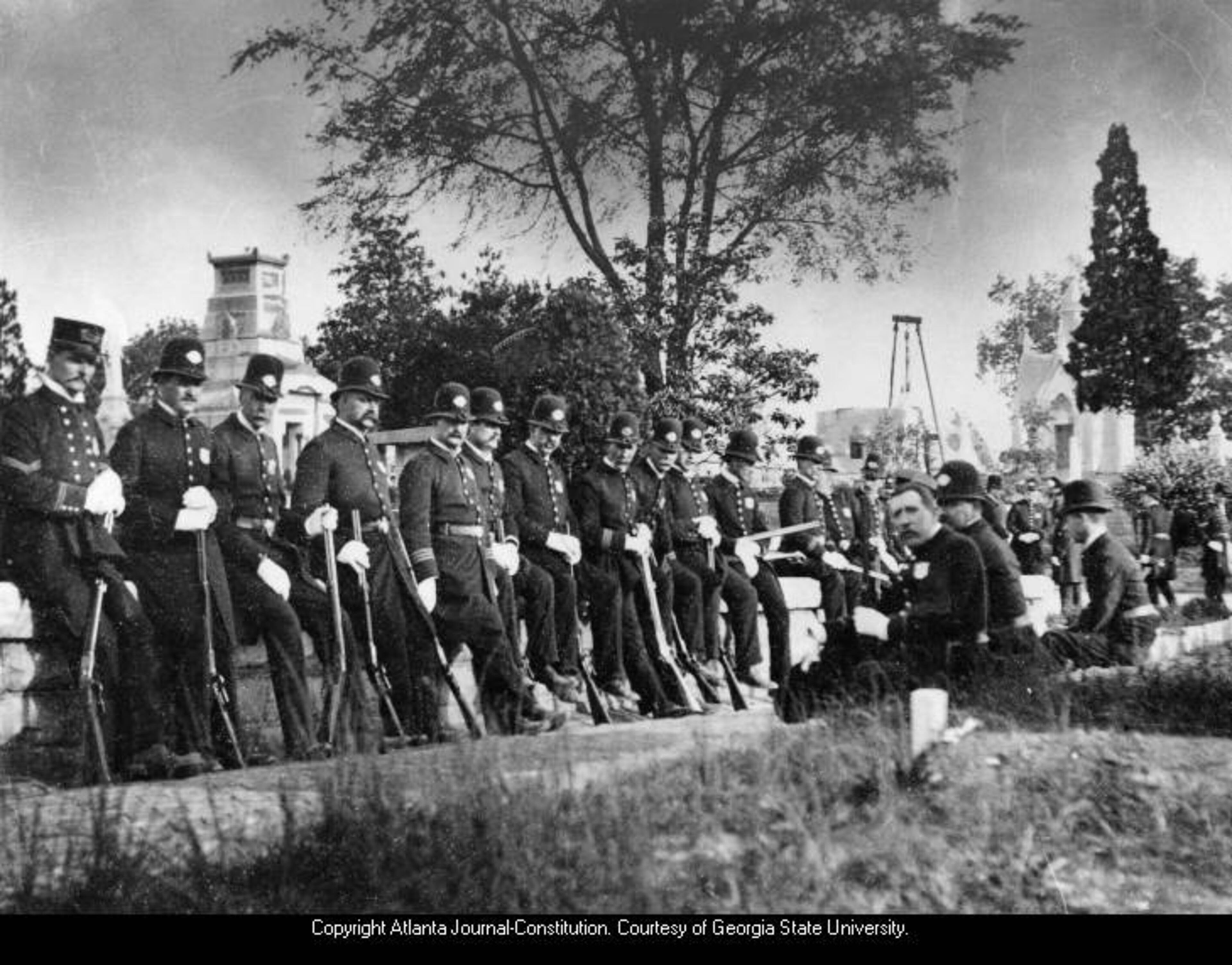 1900 -- Atlanta police officers gather in Oakland Cemetery on Decoration Day. CHARLES KILLIAN / SPECIAL TO AJC