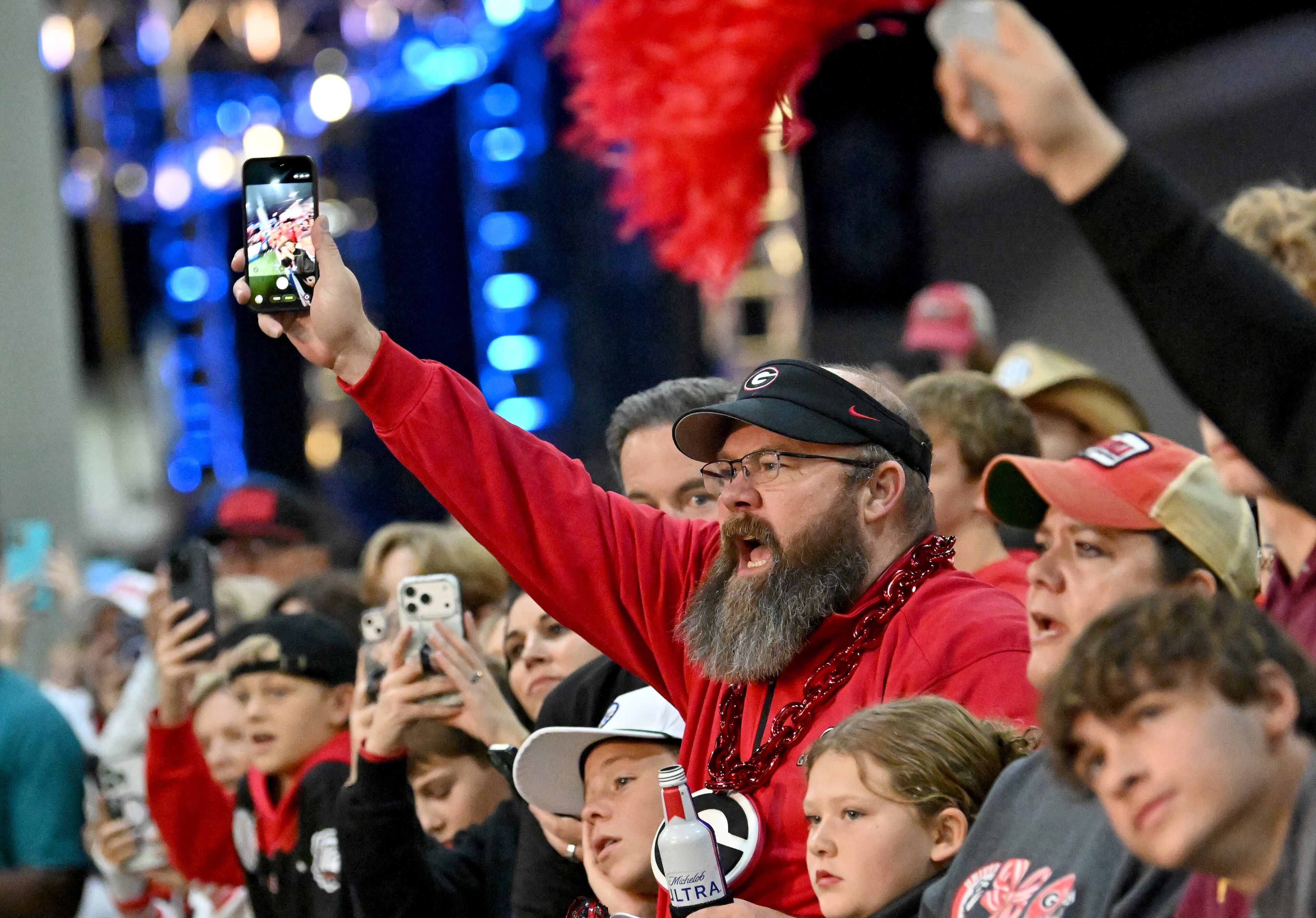Georgia fans cheer during pep rallies at The Dr Pepper SEC FanFare ahead of the SEC Championship football game between Georgia and Alabama, Saturday, Dec. 6, 2025 in Atlanta. (Hyosub Shin/AJC)