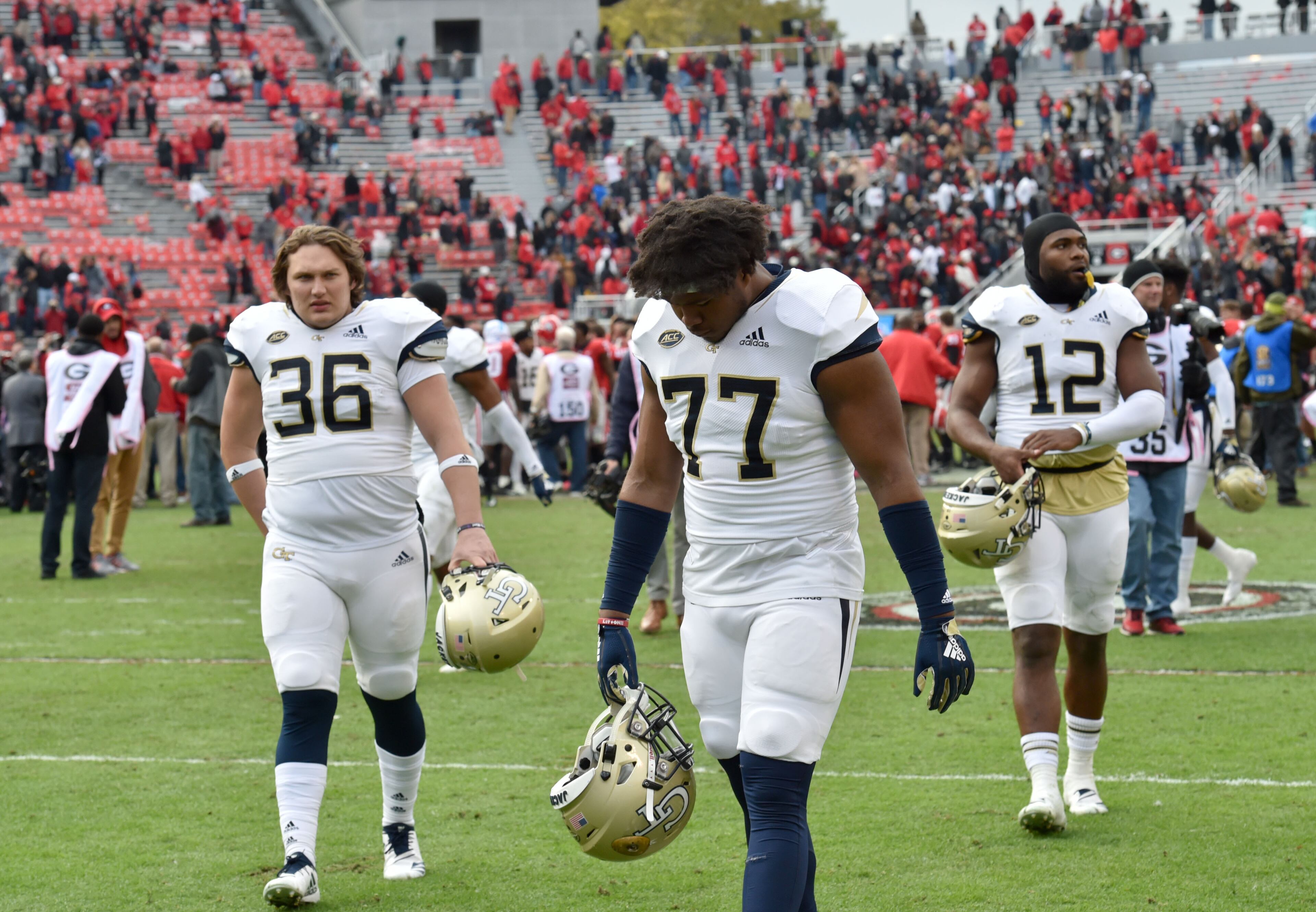 November 24, 2018 Athens - Georgia Tech players leave the football field after Georgia defeated the Georgia Tech in a NCAA college football game at Sanford Stadium on Saturday, November 24, 2018. Georgia won 45 - 21 over the Georgia Tech. HYOSUB SHIN / HSHIN@AJC.COM