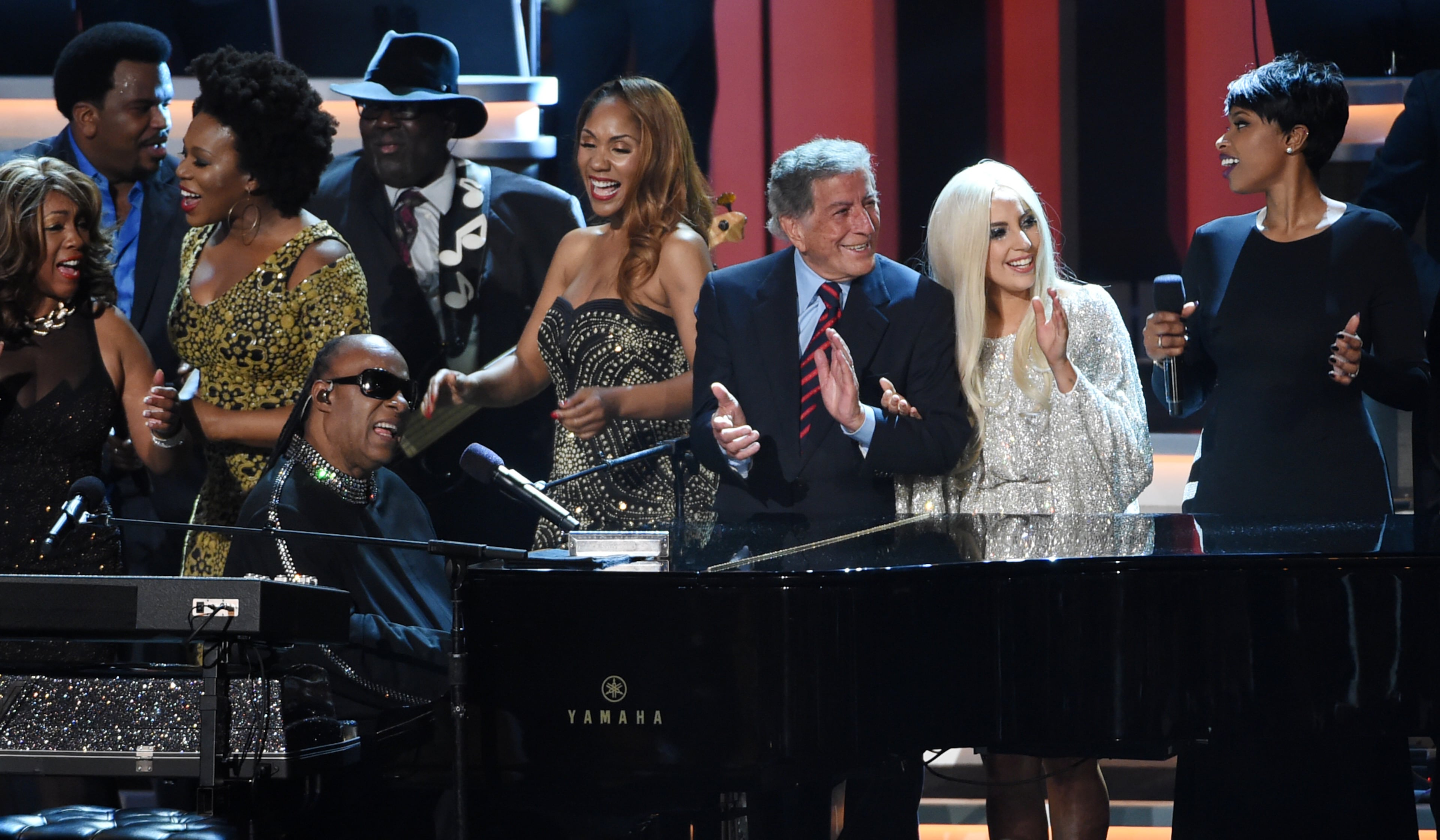 Stevie Wonder, bottom left at piano, is joined by guest performers including Tony Bennett, third from right, Lady Gaga, second from right, and Jennifer Hudson, far right, during the finale at "Stevie Wonder: Songs in the Key of Life - An All-Star Grammy Salute," at the Nokia Theatre L.A. Live on Tuesday, Feb. 10, 2015, in Los Angeles. (Photo by Chris Pizzello/Invision/AP)