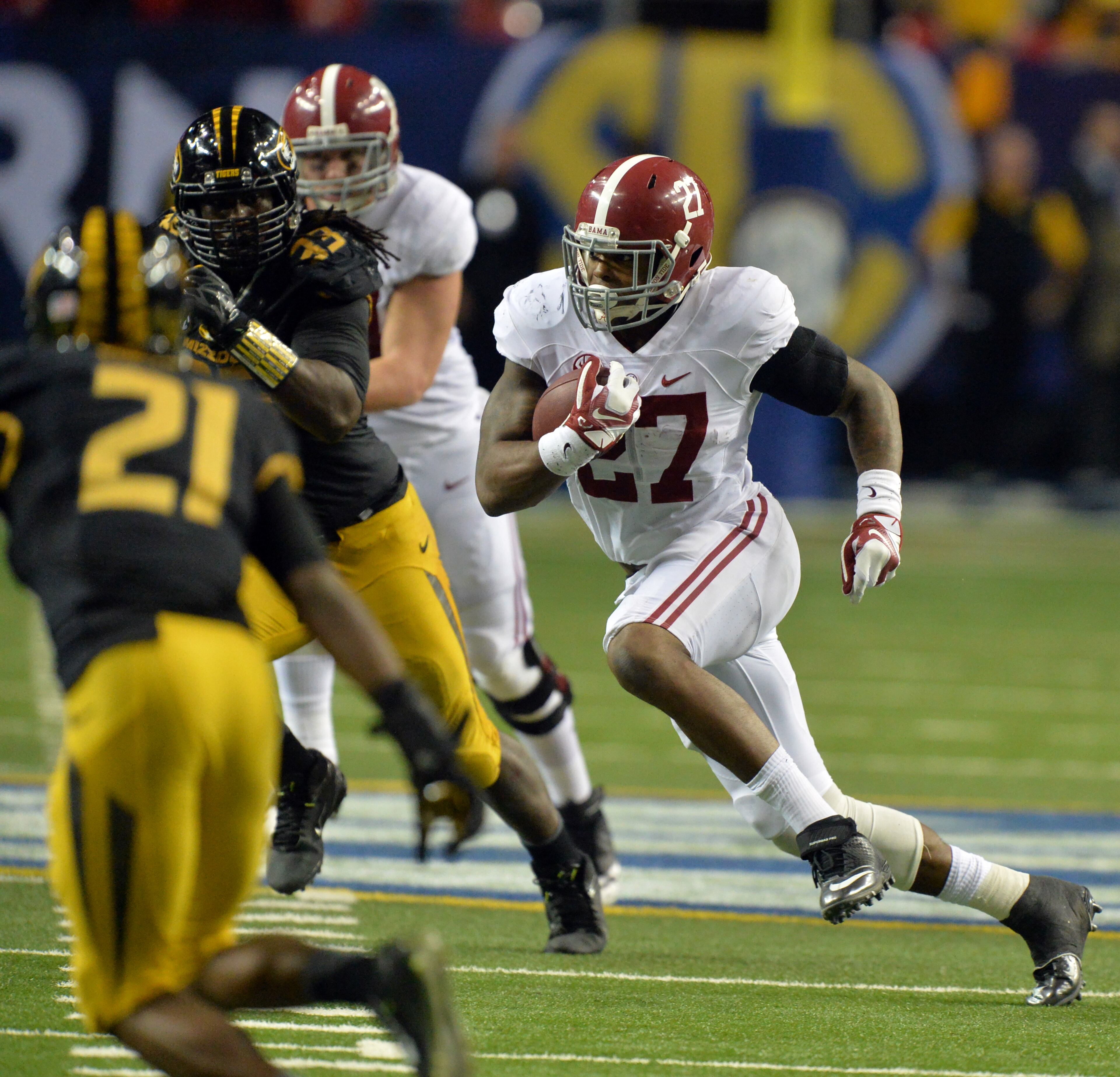 December 6, 2014 Atlanta:Alabama Crimson Tide running back Derrick Henry looks for running room against Missouri during the 4th quarter of the 2014 SEC Championship at the Georgia Dome Saturday December 6, 2014. BRANT SANDERLIN / BSANDERLIN@AJC.COM