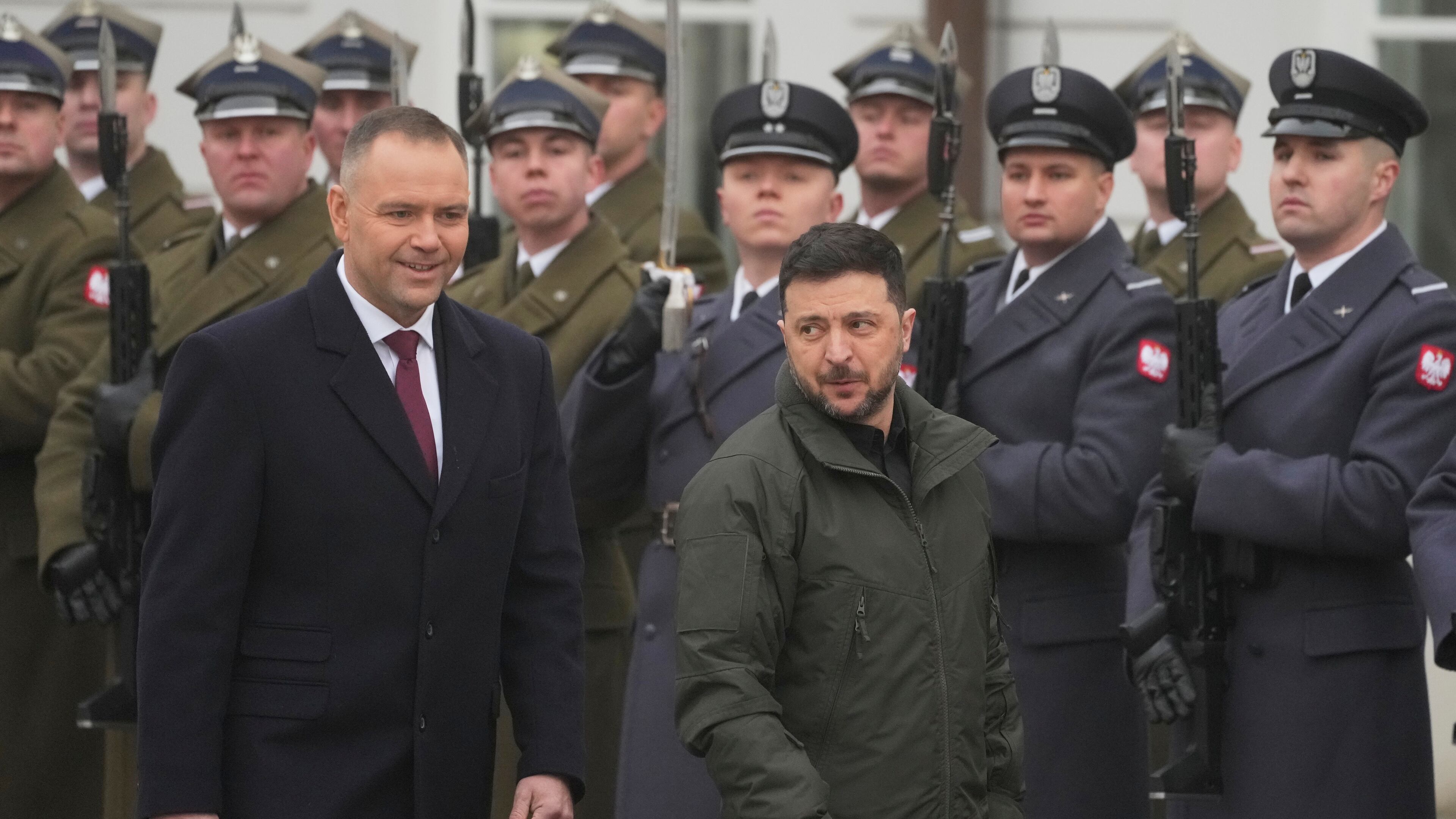 Polish President Karol Nawrocki, left, and Ukrainian President Volodymyr Zelenskyy attend an official welcome ceremony before their meeting at the Presidential Palace in Warsaw, Poland, Friday, Dec. 19, 2025. (AP Photo/Czarek Sokolowski)
