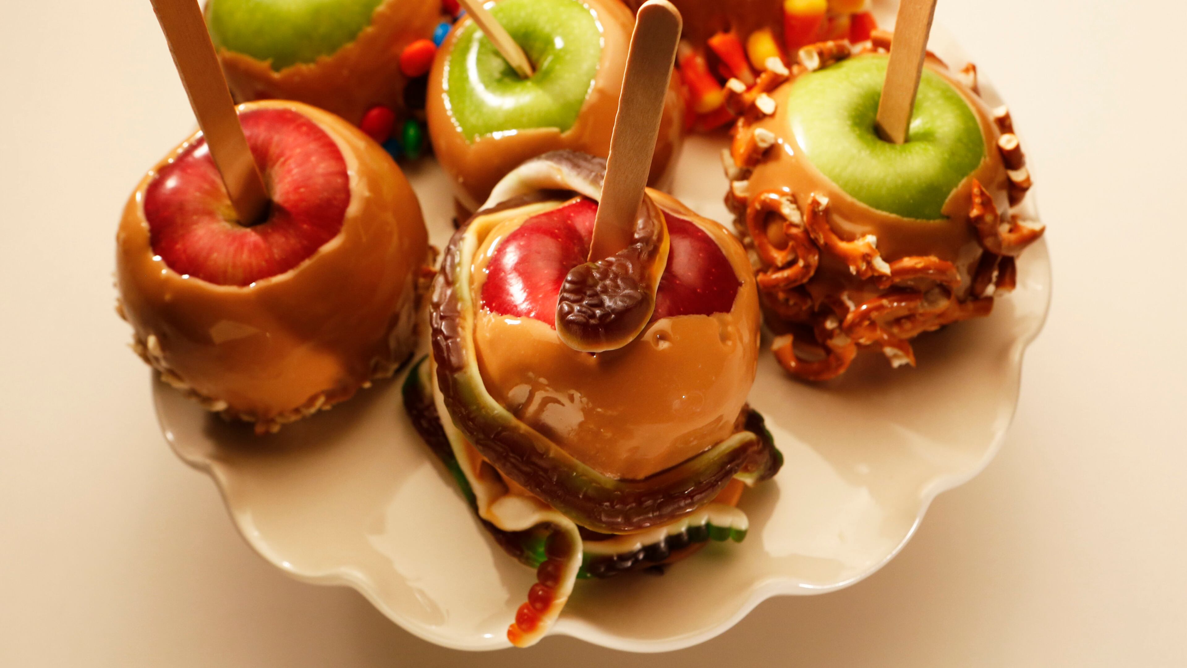 Have the kids help unwrap the candies and dip the apples in the caramel, before decorating with an assortment of candies, nuts or dried fruit. (Anne Cusack/Los Angeles Times/MCT)