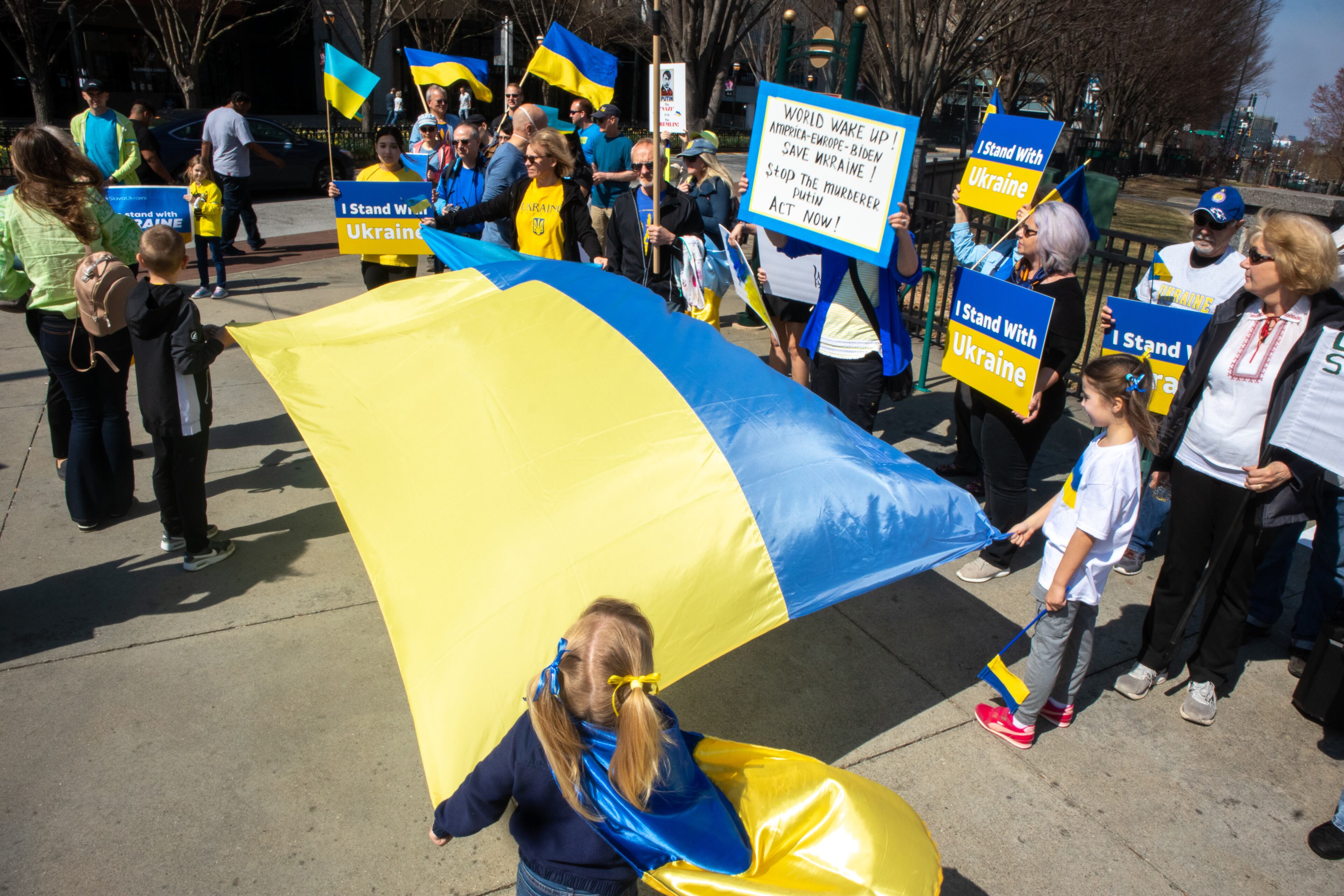 A crowd gathers near the CNN Center during a rally organized by the Ukrainian Community of Atlanta Saturday, March 5, 2022. STEVE SCHAEFER FOR THE ATLANTA JOURNAL-CONSTITUTION