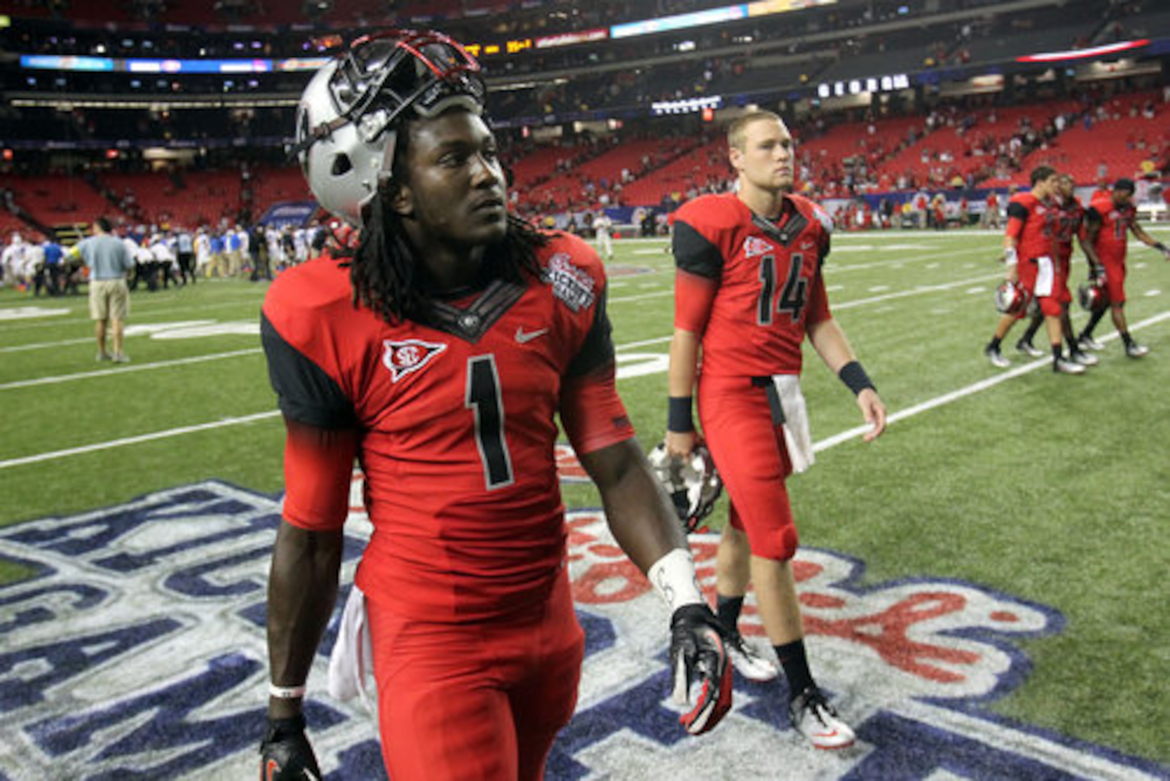 Georgia freshman tailback Isaiah Crowell (1) walks off of the field after Georgia lost to Boise State 35-21 in the Chick-fil-A Kickoff Game Saturday night at the Georgia Dome. Crowell finished with 59 yards on 15 carries and no scores.
