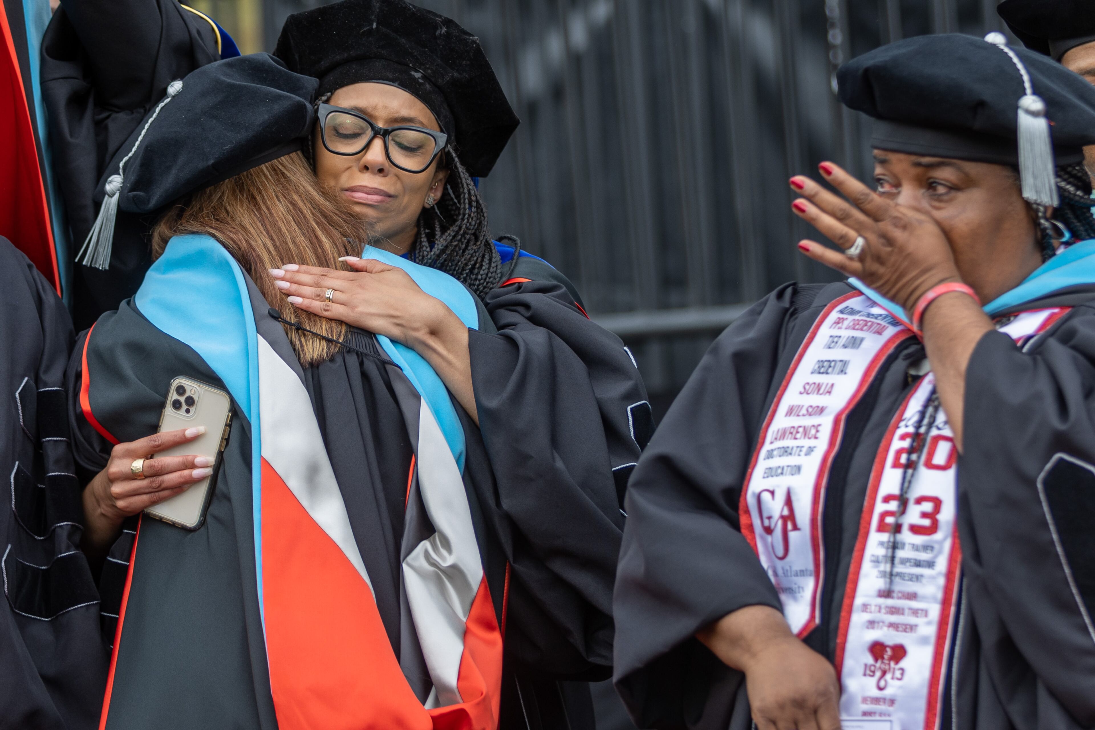 Emotions run high after the doctoral hooding ceremony during the Atlanta University commencement ceremony in Panther Stadium on Saturday, May 20, 2023. (Steve Schaefer / steve.schaefer@ajc.com)