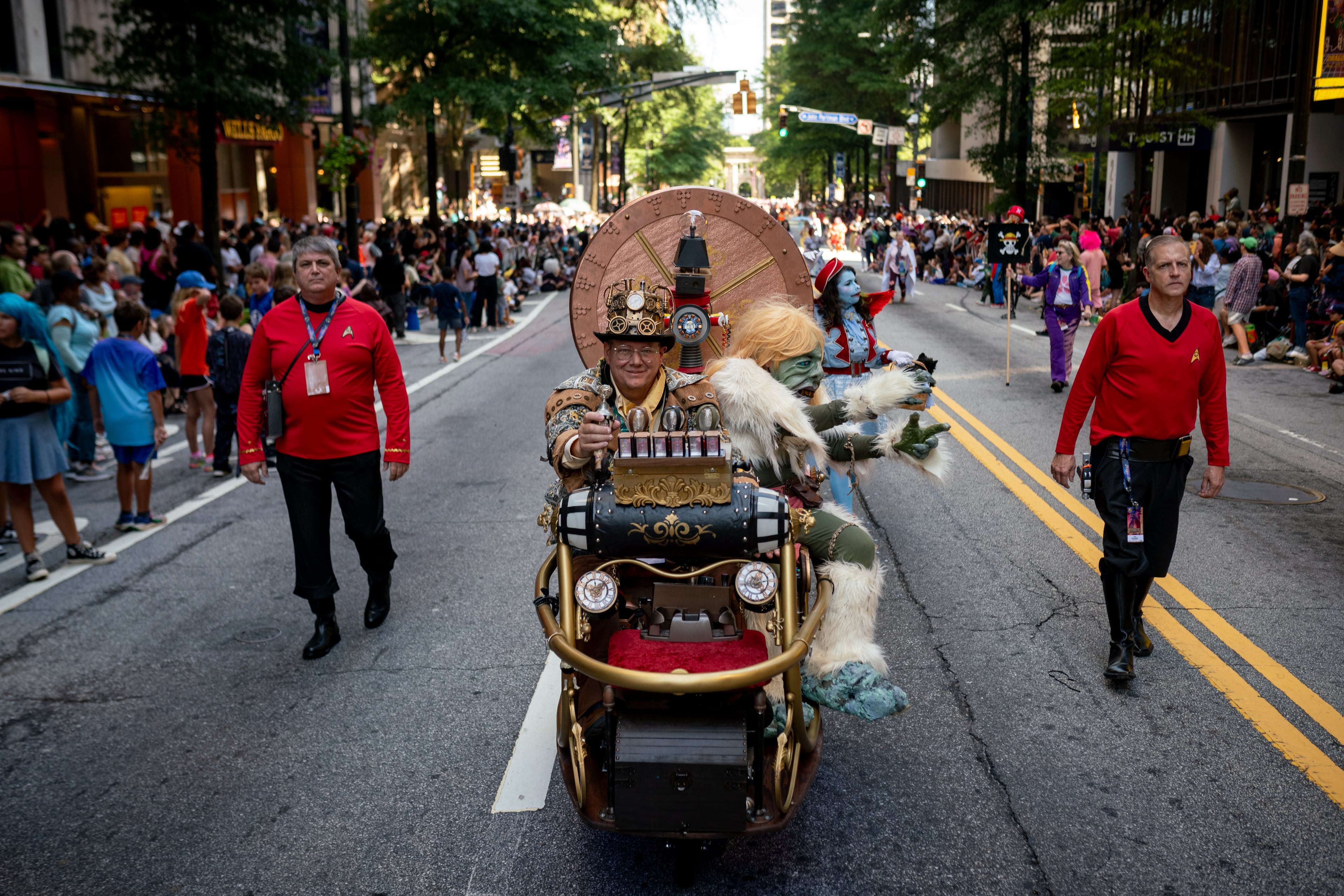 Thousands lined up along Peachtree Street on Saturday morning, August 31, 2024, for the annual Dragon Con parade in Atlanta. (Ben Hendren for The Atlanta Journal-Constitution)