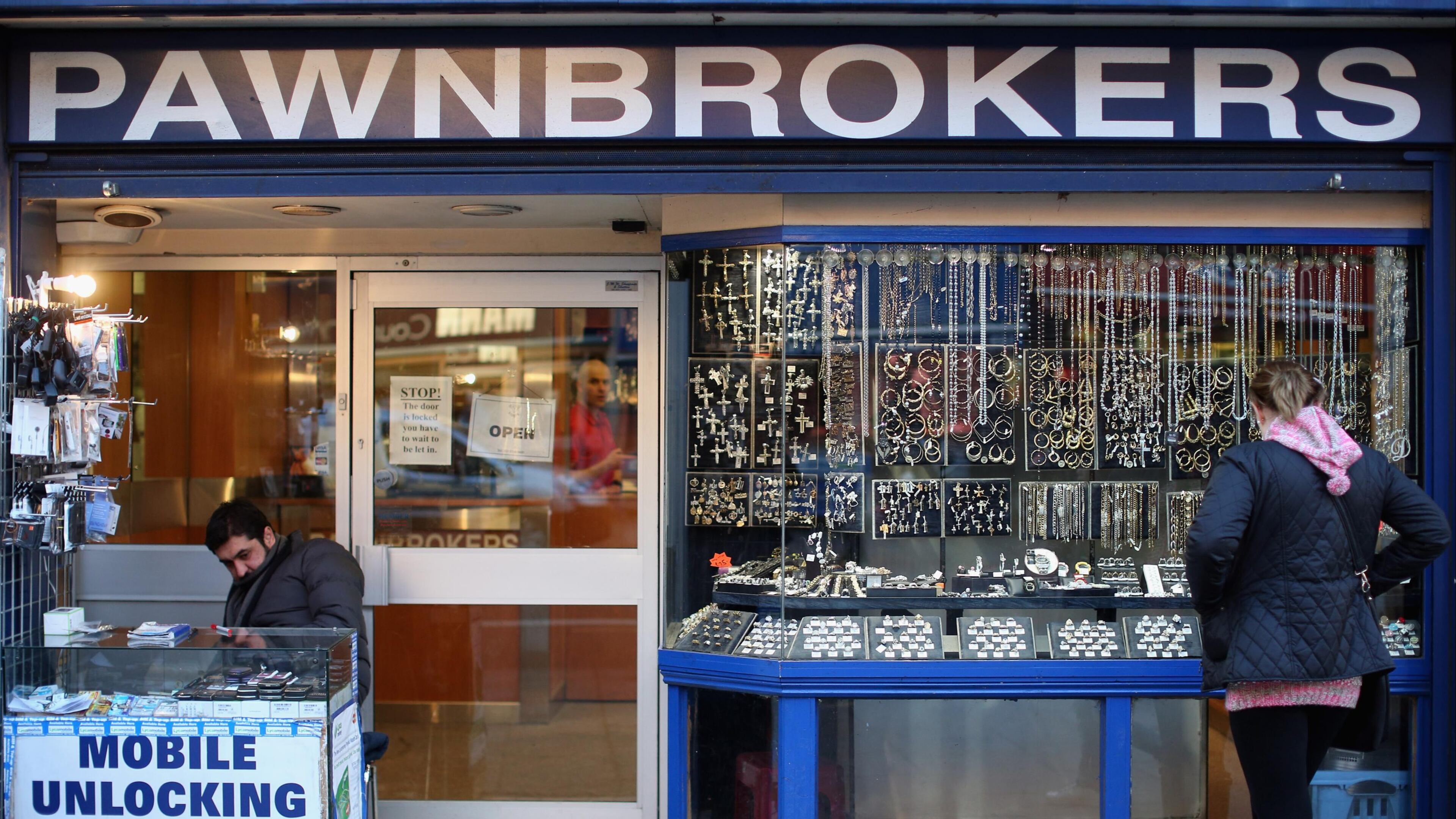 Middle Georgia’s largest county is banning new pawn shops (not pictured) for six months and is enacting limits that will ban new liquor stores indefinitely. (Oli Scarff/file photo)