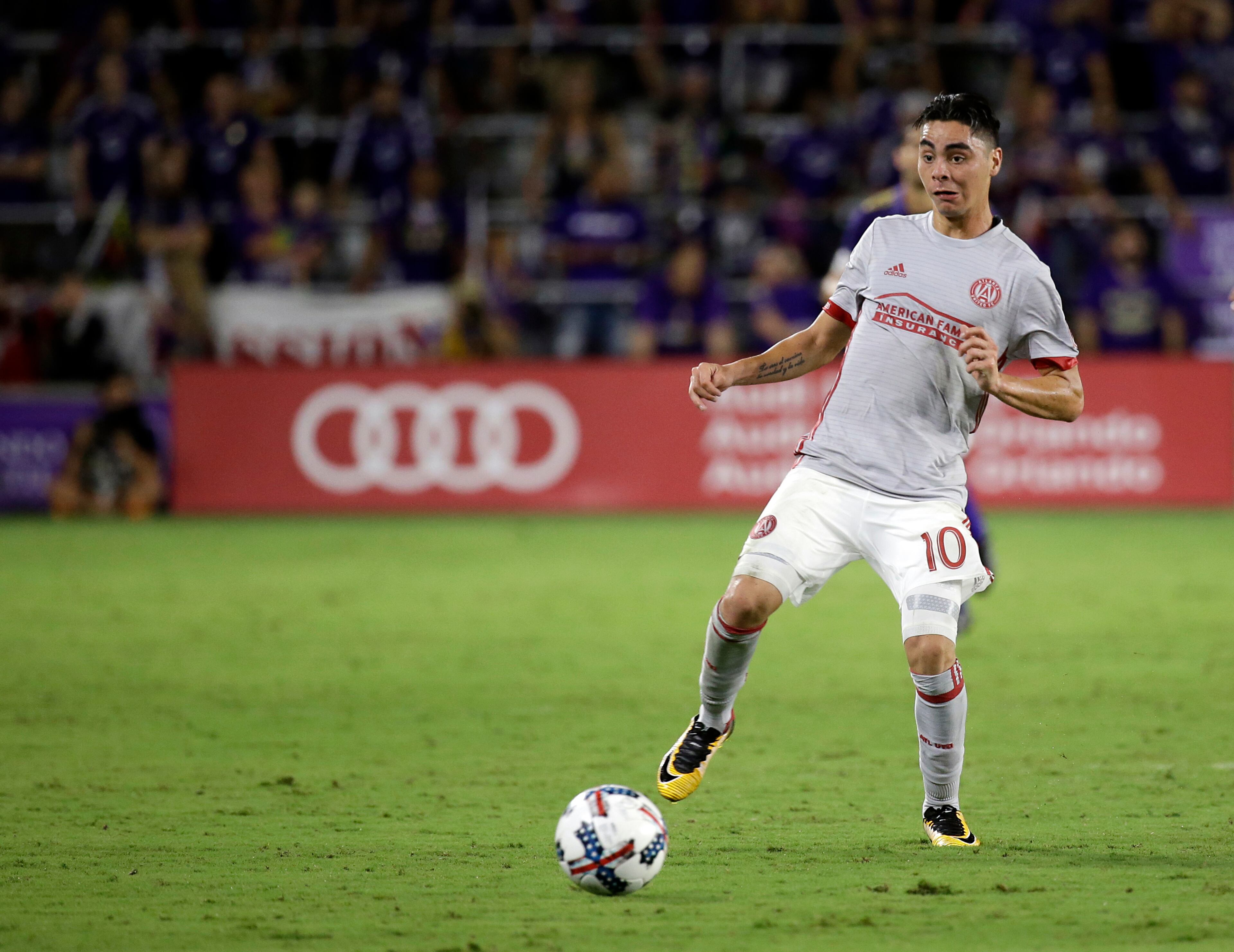 Atlanta United's Miguel Almiron (10) moves the ball against Orlando City during the second half of an MLS soccer match, Friday, July 21, 2017, in Orlando, Fla. Atlanta United won 1-0. (AP Photo/John Raoux)