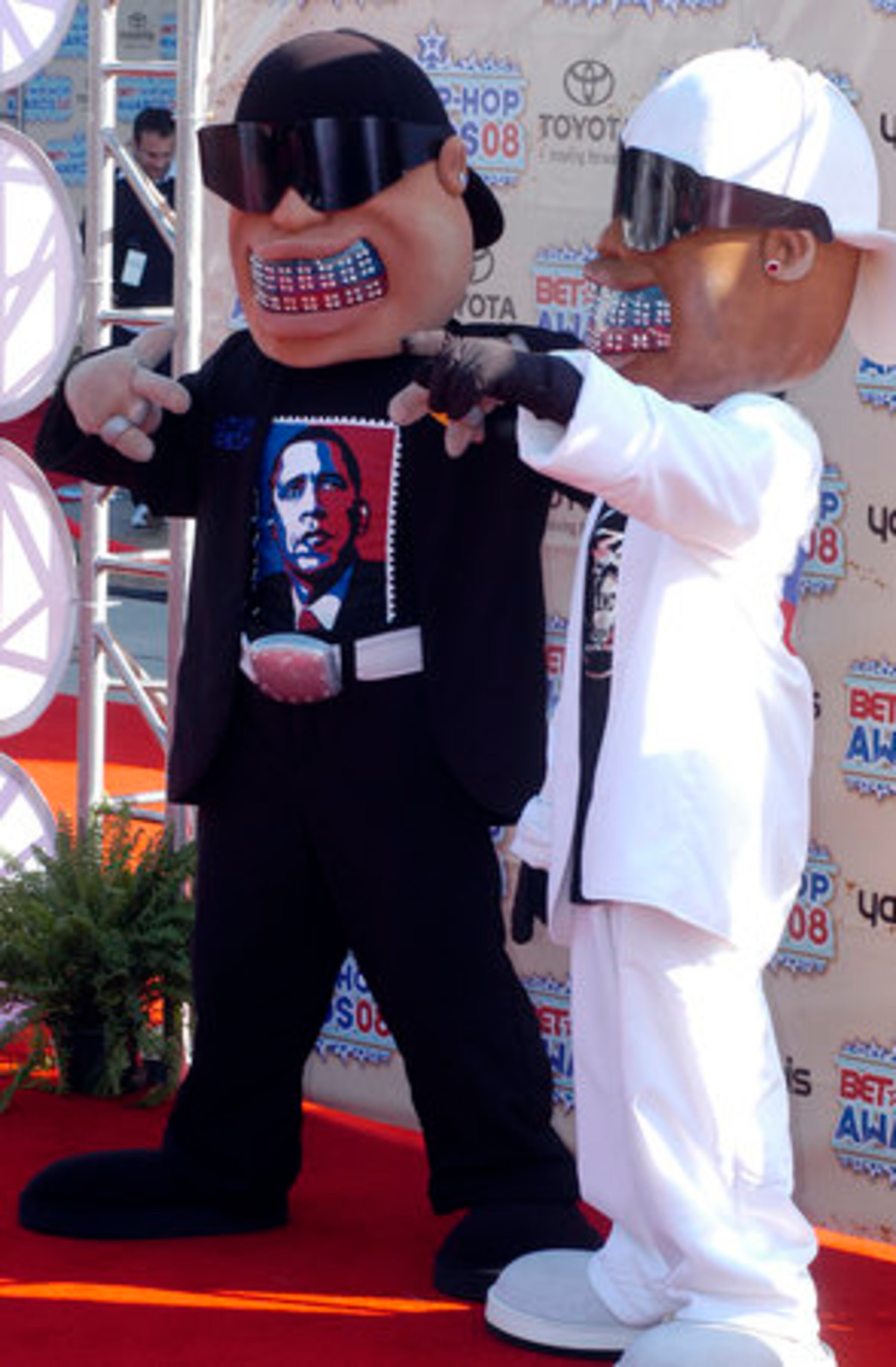 The mascots for Haitian Fresh were flashing their oversize grins and ...