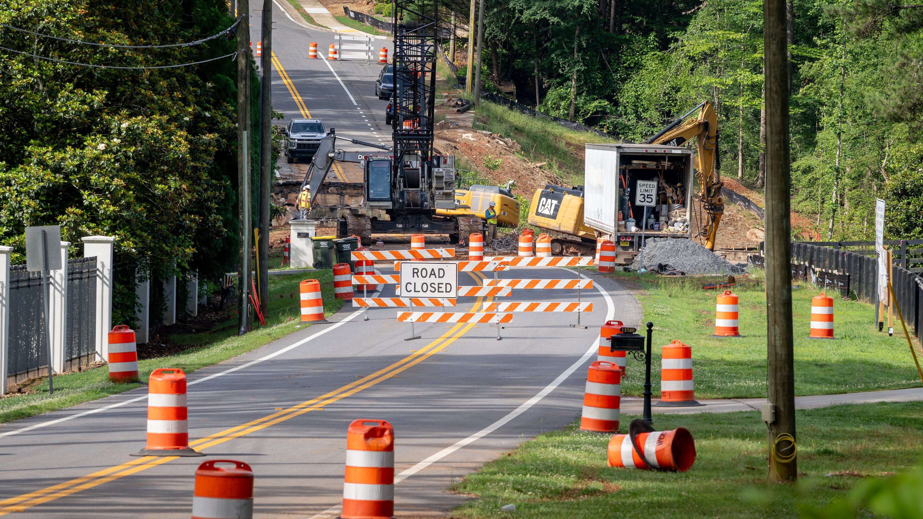Work is underway to replace the Freemanville Road bridge on Thursday, May 28, 2026, in Milton. The state transportation agency says its inspectors determined a new bridge was needed to replace the structure, originally erected in 1960. (Ben Hendren for the AJC)