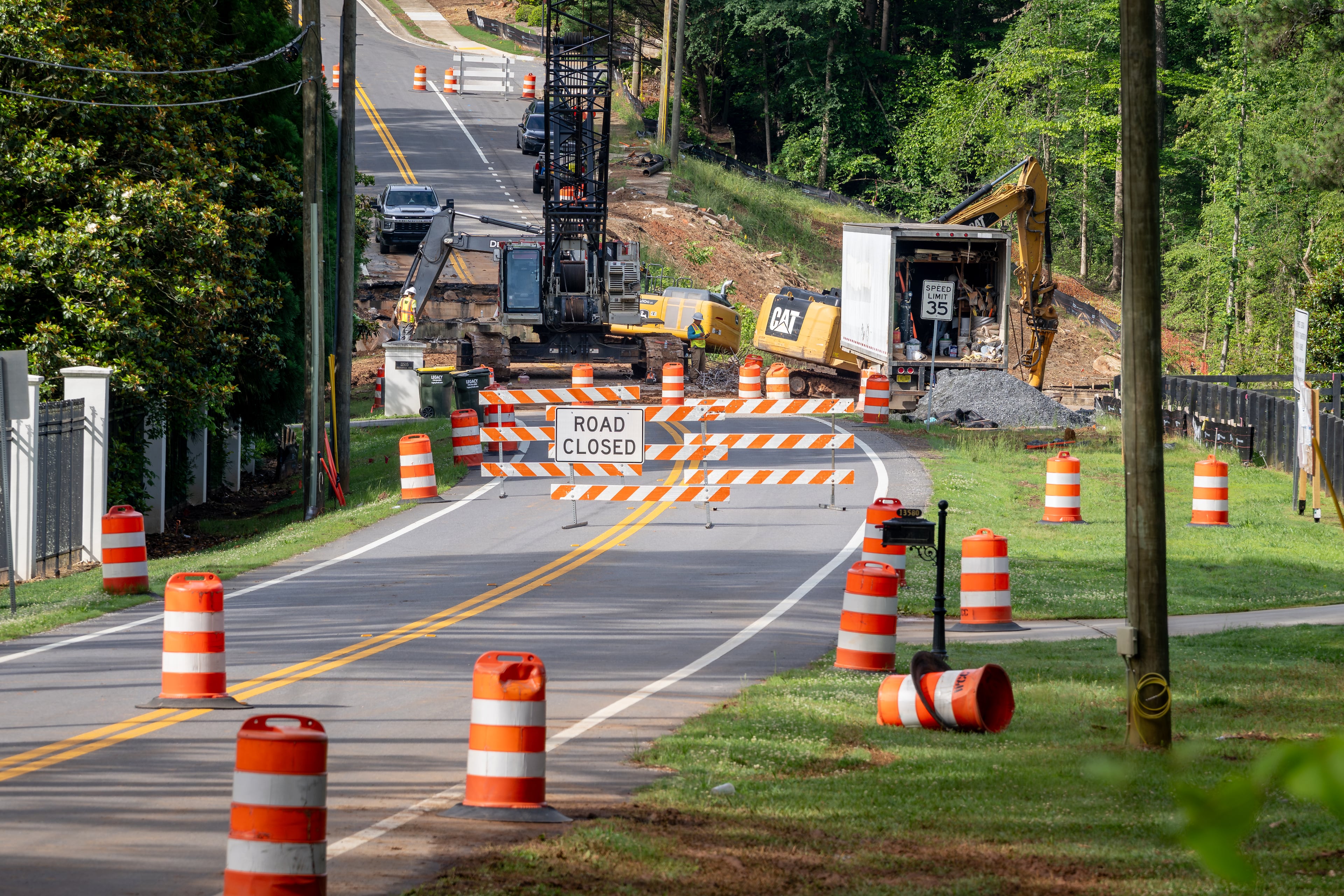 Work is underway to replace the Freemanville Road bridge on Thursday, May 28, 2026, in Milton. The state transportation agency says its inspectors determined a new bridge was needed to replace the structure, originally erected in 1960. (Ben Hendren for the AJC)