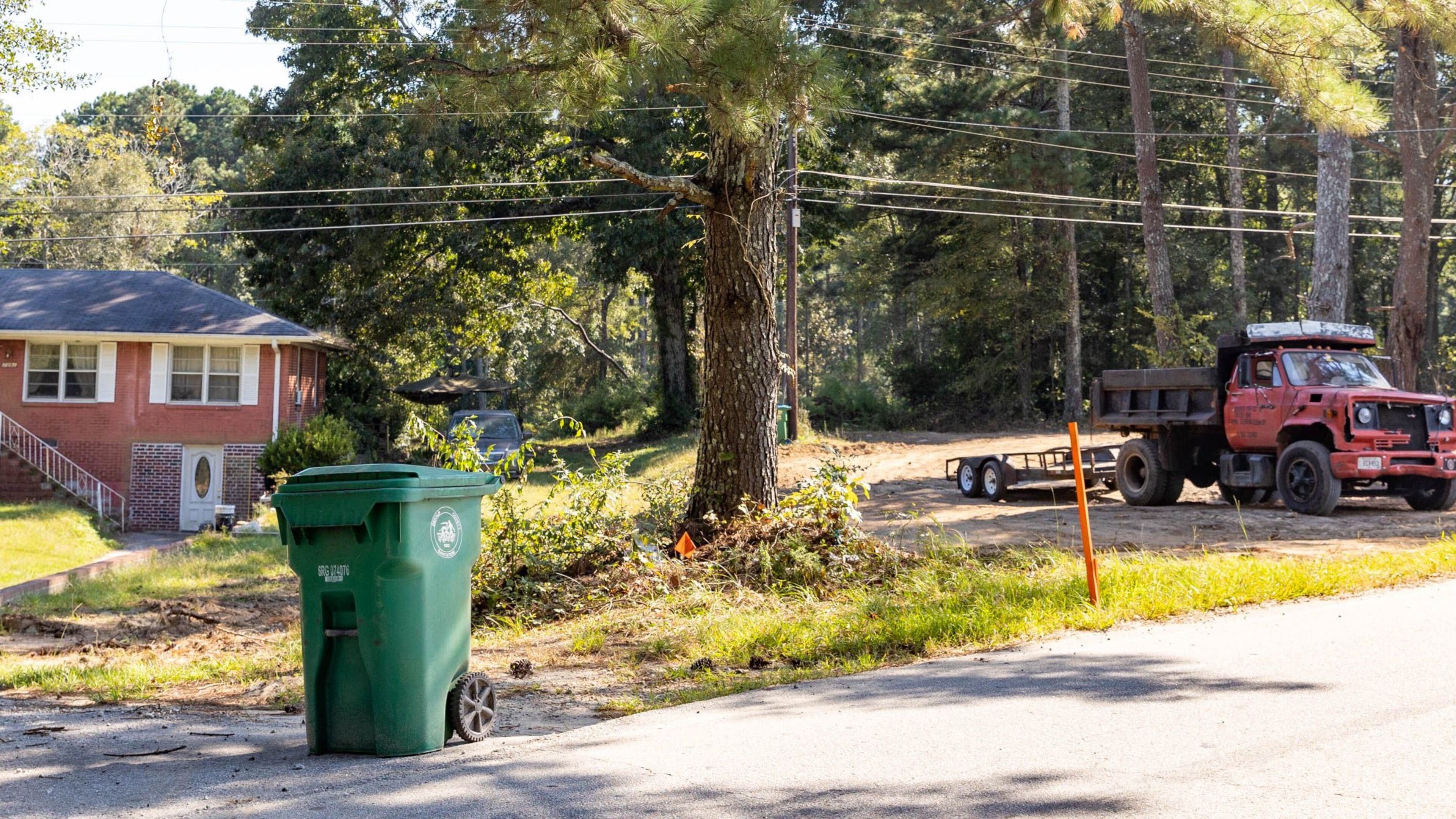 Stonecrest zoning has created several locations including this home on Maddox Road near Rogers Lake Road where residential properties are next to industrial operations allowing for industrial vehicles to overflow roadways, abandoned homes to be turned into dump sites and DeKalb County residents live beside concrete production facilities and junkyards. (Jenni Girtman for The Atlanta Journal-Constitution)