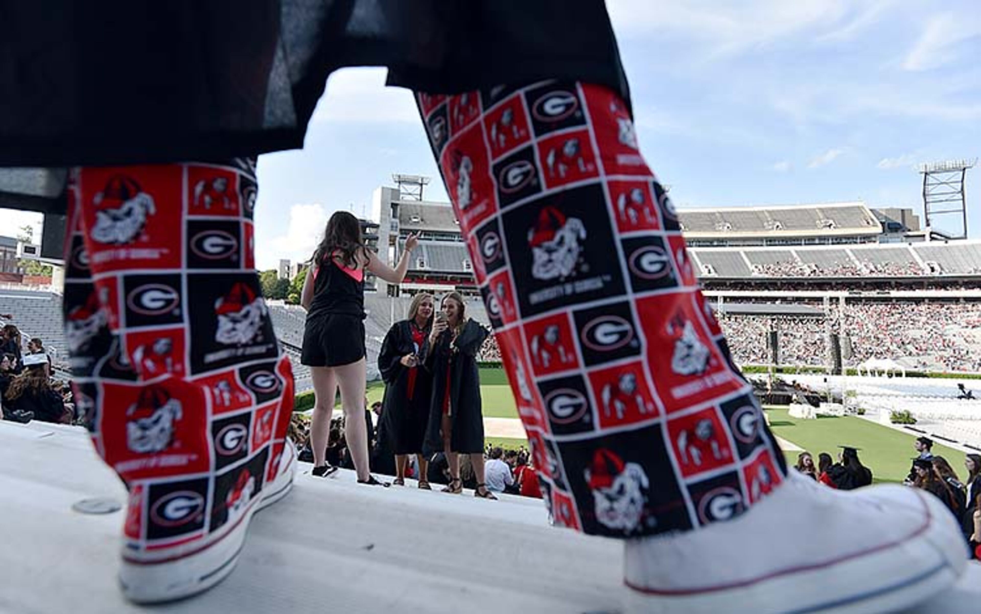 May 10, 2019 Athens - University of Georgia students take their selfies before 2019 spring undergraduate commencement ceremony at Sanford Stadium in Athens on Friday, May 10, 2019. HYOSUB SHIN / HSHIN@AJC.COM