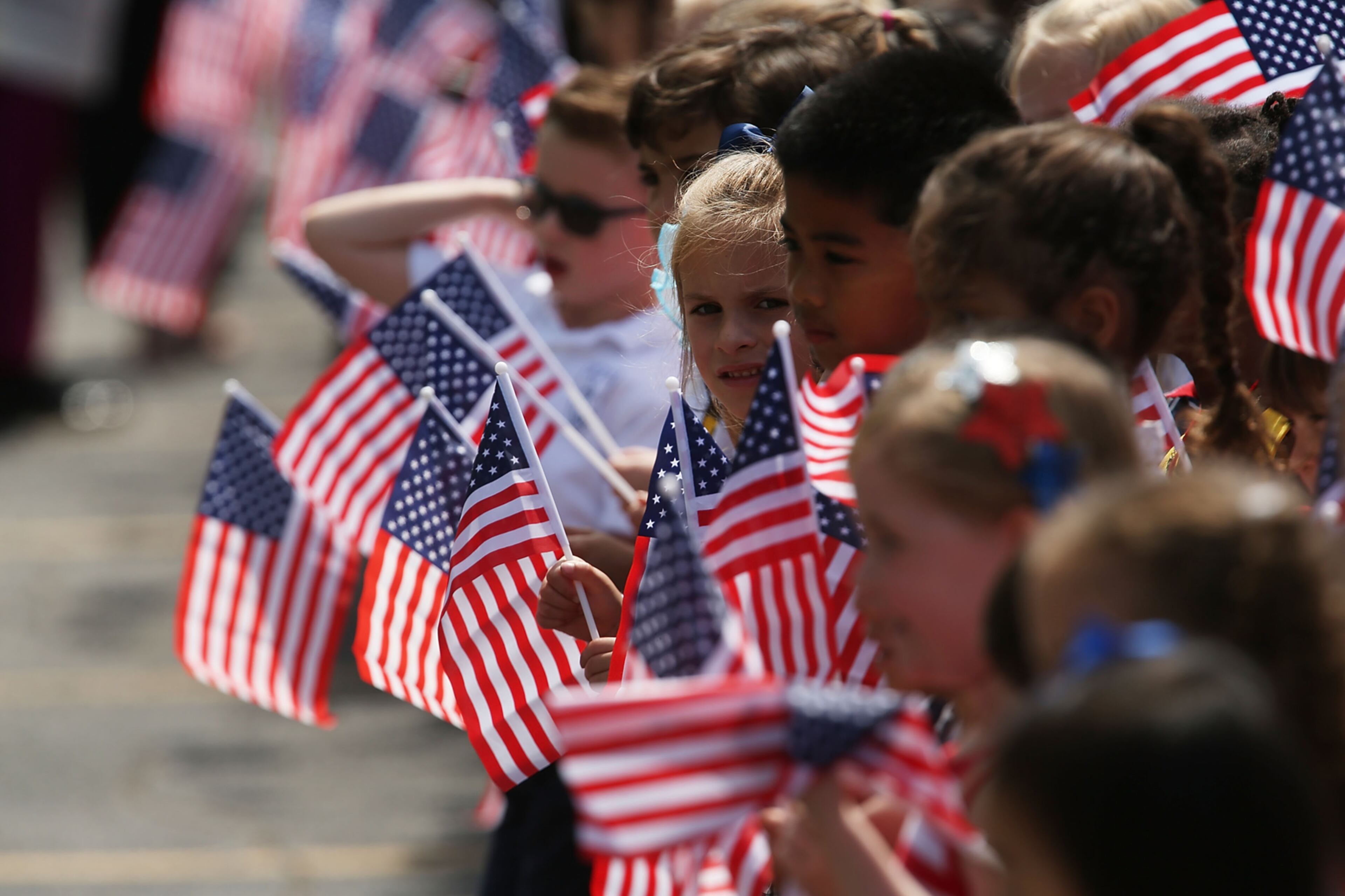 HICKSVILLE, NY - JUNE 02: Local school children attend the funeral of retired FDNY firefighter Ray Pfeifer on June 2, 2017 in Hicksville, New York. Pfeifer, 59, fought a years-long battle with cancer attributed to his work at Ground Zero after the 9/11 terrorist attacks. The 27-year FDNY veteran spent about eight months working on the pile site of debris in lower Manhattan and was instrumental in getting lawmakers to pass the James L. Zadroga 9/11 Health & Compensation Act. (Photo by Spencer Platt/Getty Images)