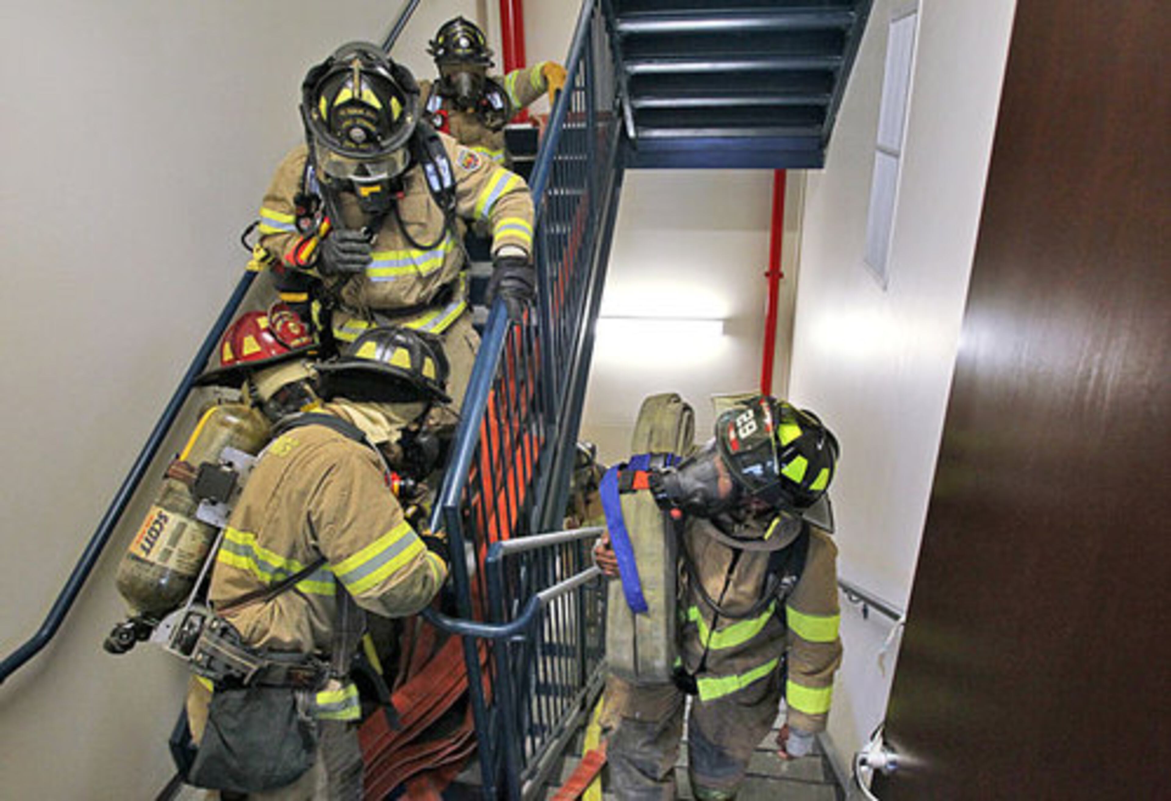 Firefighters ascended to the 12th floor from the 10th floor Wednesday to set up their firefighting operation.