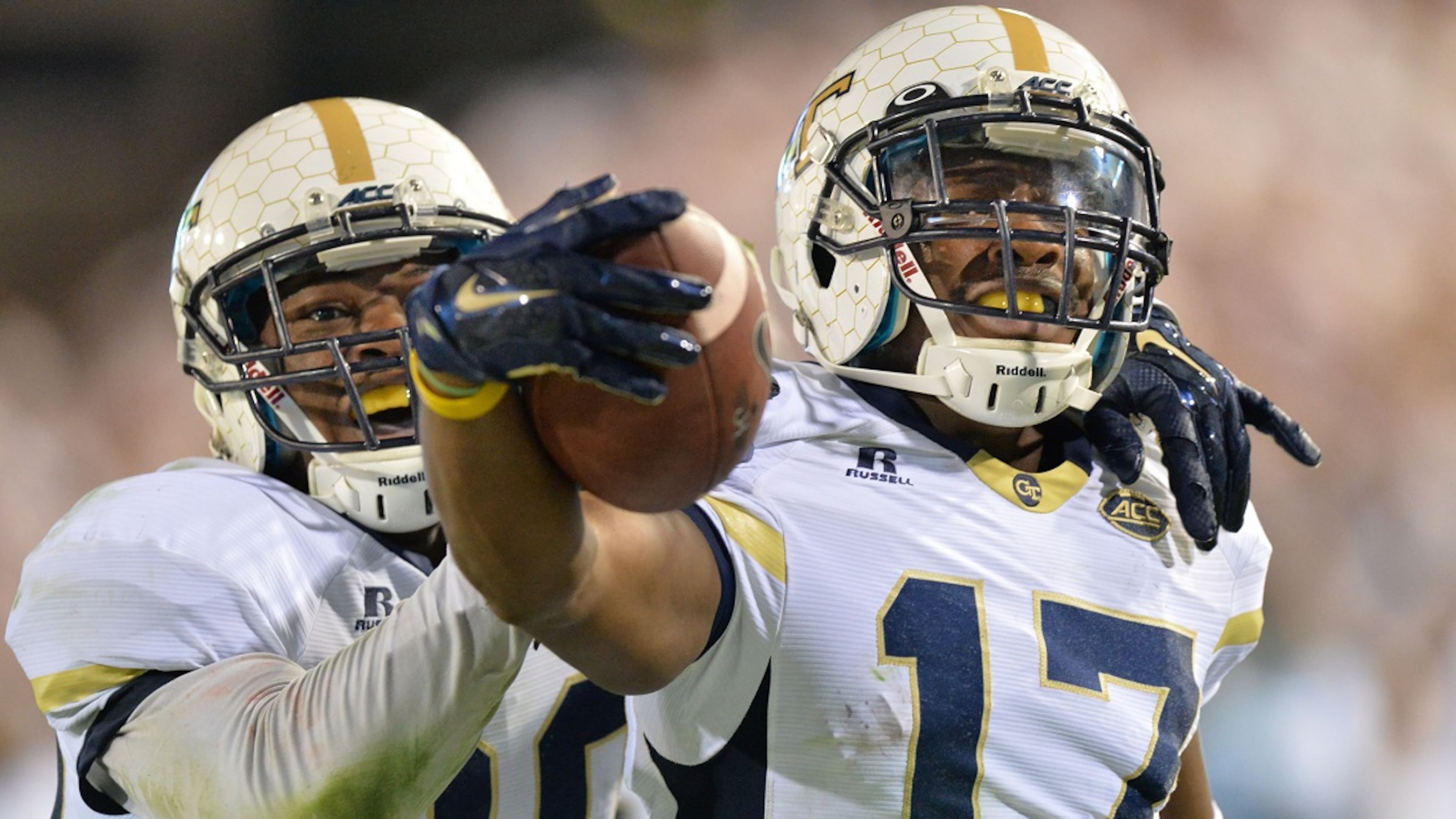 Georgia Tech Yellow Jackets defensive back Lance Austin (17) celebrated with his brother, defensive back Lawrence Austin, after he scored a touchdown at the end of the fourth quarter at Bobby Dodd Stadium on Saturday, October 24, 2015. Georgia Tech won 22-16 against Florida State. HYOSUB SHIN / HSHIN@AJC.COM