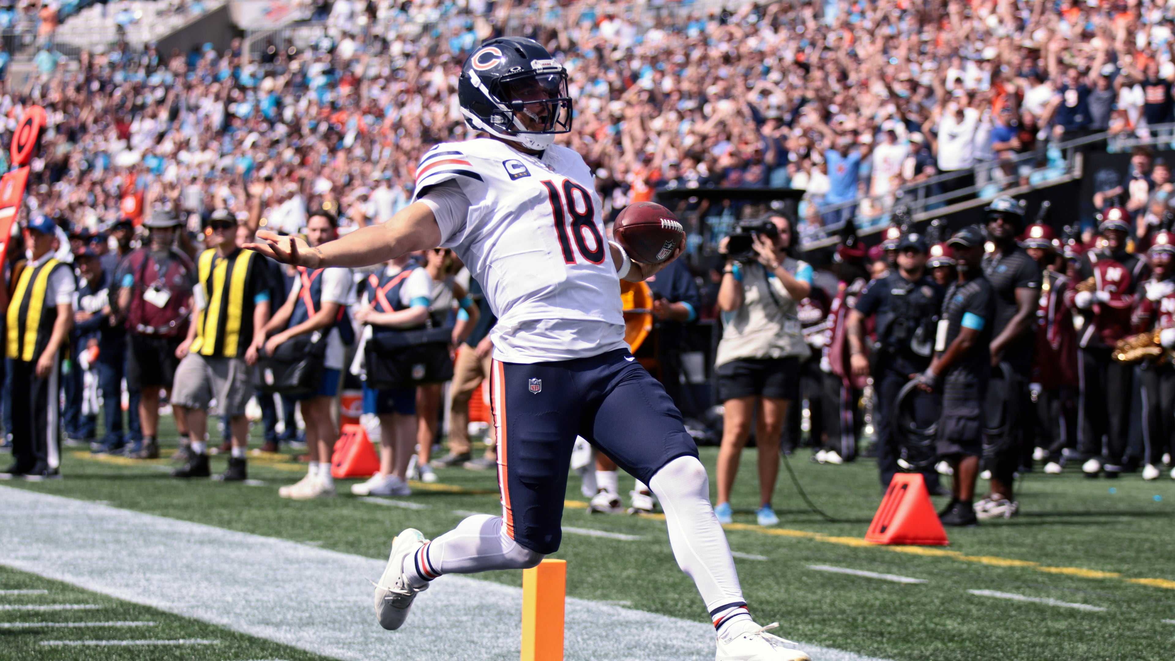 Chicago Bears quarterback Caleb Williams (18) runs to score a touchdown during the first half of an NFL football game, Sunday, Sept. 13, 2026, in Charlotte, N.C. (AP Photo/Scott Kinser)