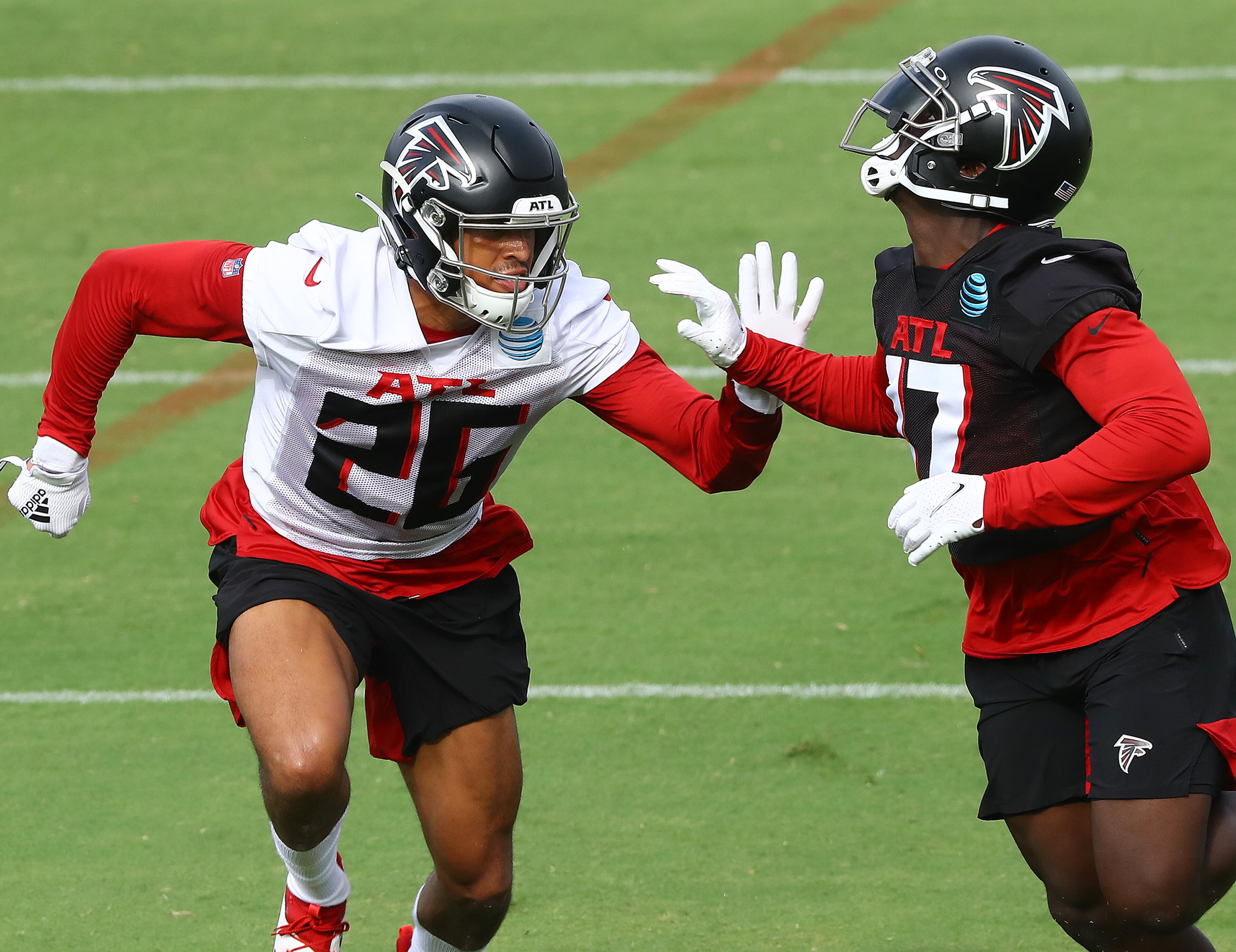 Falcons cornerback Isaiah Oliver (left) defends against wide receiver Olamide Zaccheaus. Curtis Compton ccompton@ajc.com