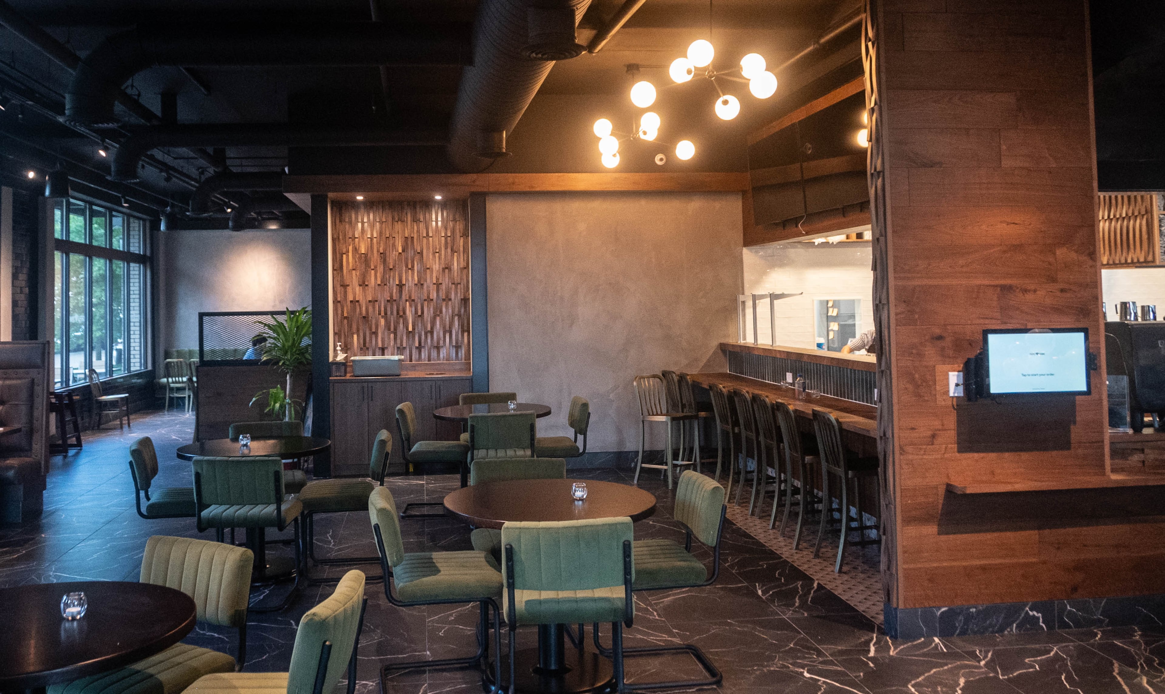 The dining room at Cafe Crepes Square in Savannah offers a variety of seating. (Bill Dawers for the AJC)