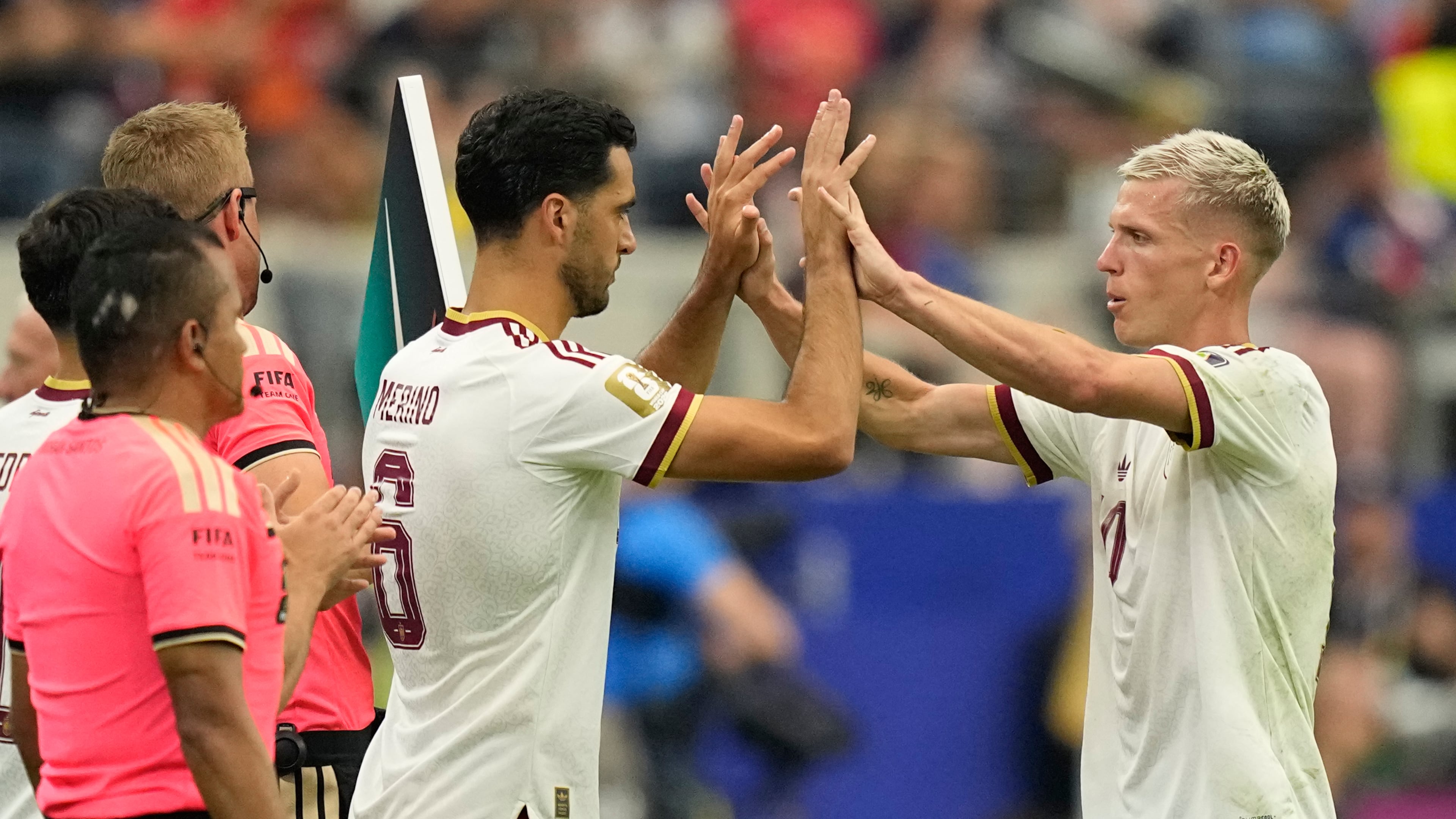 Spain's Dani Olmo, right, greets teammate Mikel Merino (6) as Olmo is replaced by Merino during the World Cup semifinal soccer match between France and Spain in Arlington, Texas, near Dallas, Tuesday, July 14, 2026. (AP Photo/Ashley Landis)