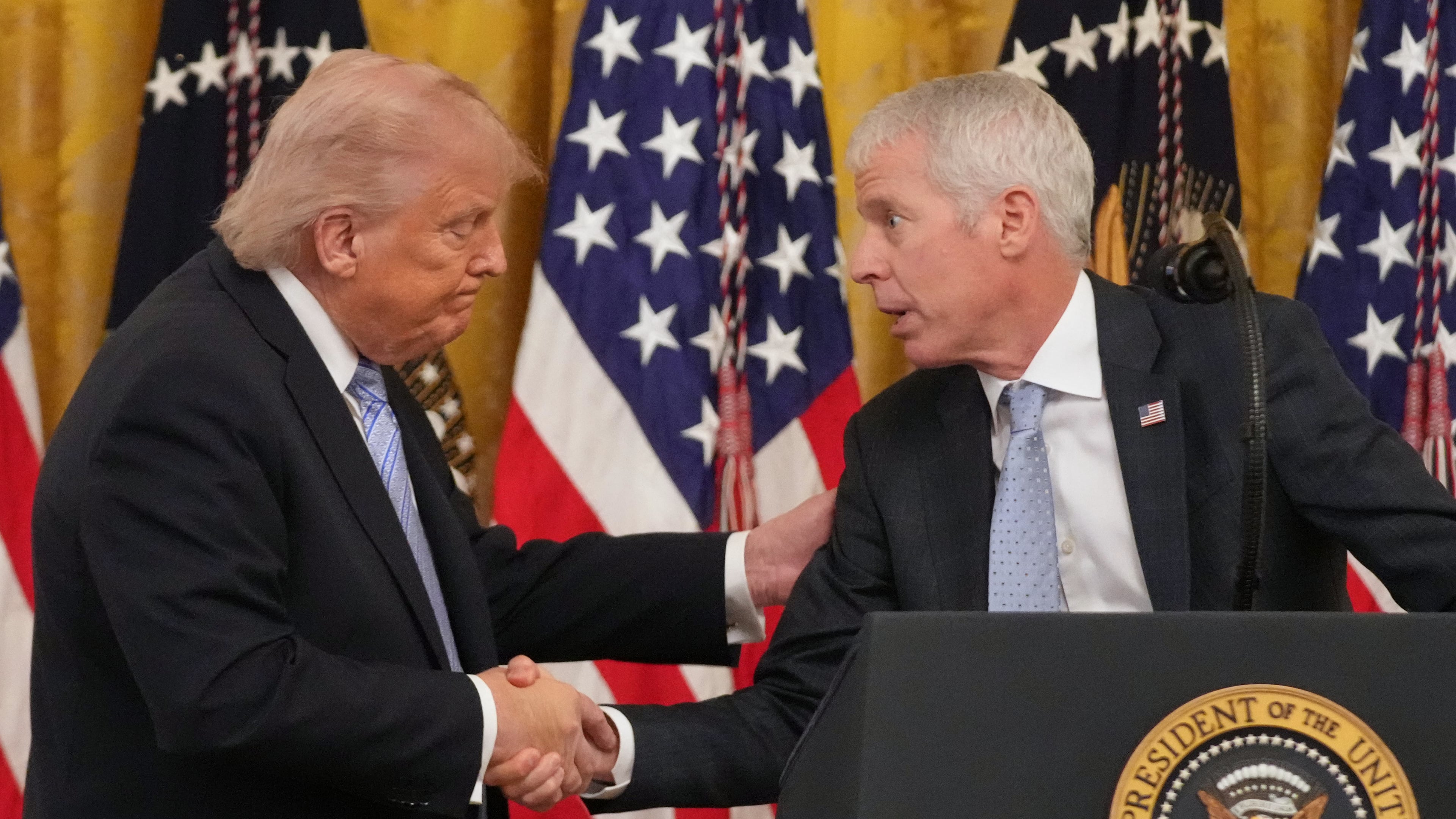FILE - President Donald Trump shakes hands with Energy Secretary Chris Wright, right, during an event with small business owners May 4, 2026, in the East Room at the White House in Washington. (AP Photo/Mark Schiefelbein, File)