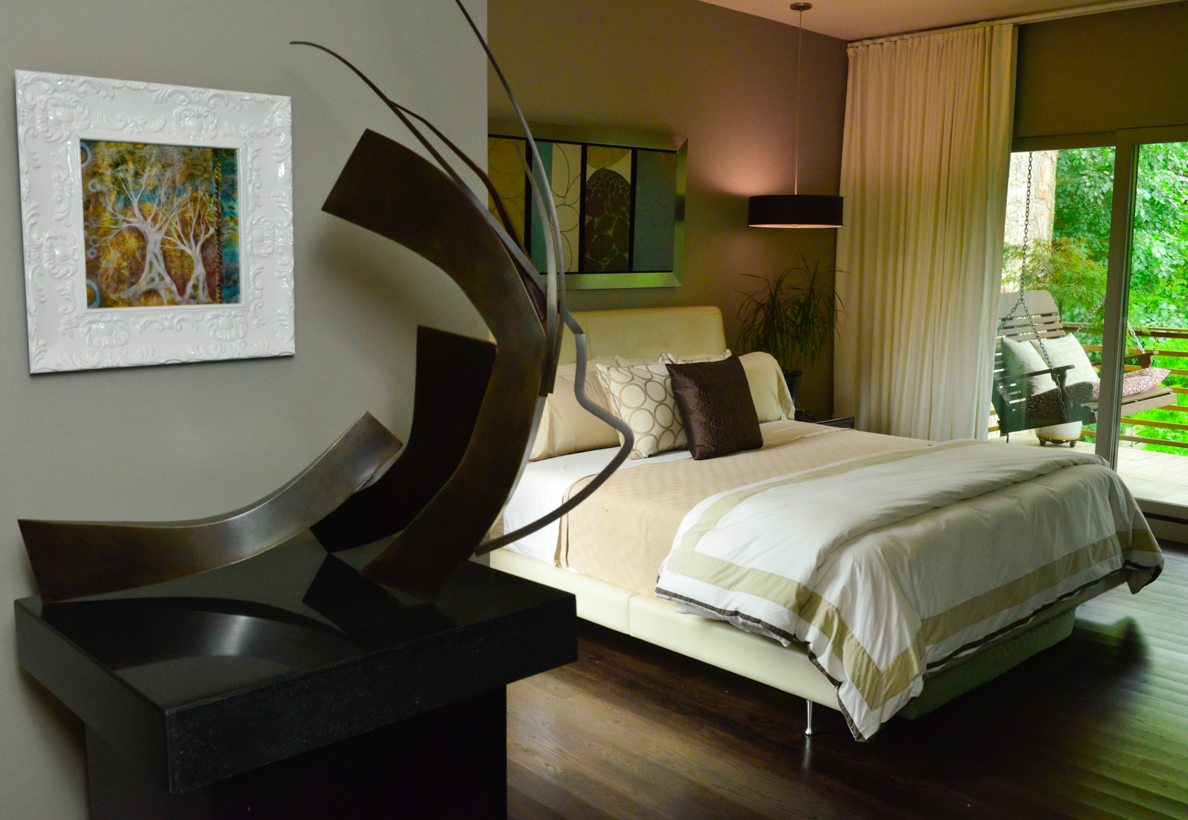 A sculpture in the master bedroom was free. A tenant in the Buckhead office building where Randy Harris used to work moved out and left the sculpture in the hallway for months. "The landlord said does anybody want this? Nobody did except me," Harris said. "That was a found piece of sculpture that perfectly fit in our home."