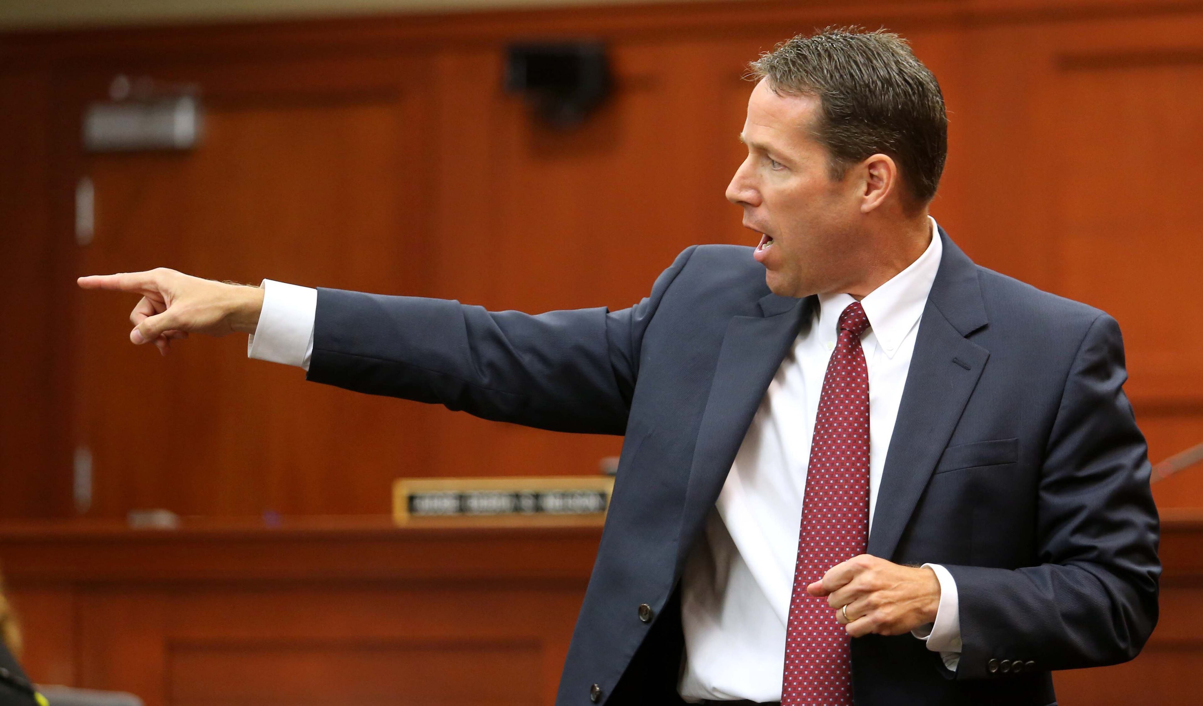 Assistant State Attorney John Guy points out defendant George Zimmerman as the shooter of Trayvon Martin during the state's opening argument in front of the jury in the Zimmerman trial, in Seminole circuit court, in Sanford, Florida, Monday, June 24, 2013. (Joe Burbank/Orlando Sentinel/MCT)