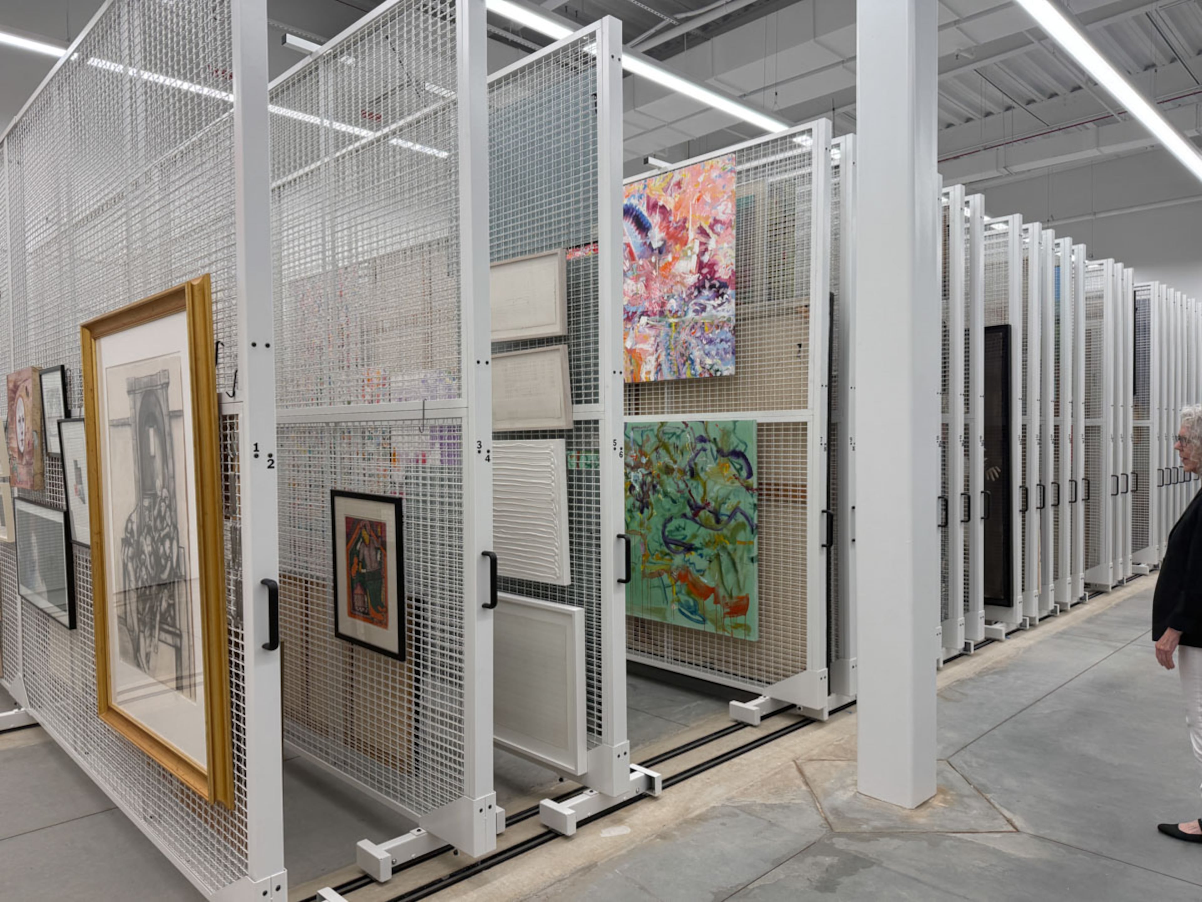 Annette Cone-Skelton shows off the archives center inside MOCA GA’s new home. The room houses the museum’s permanent collection, which has grown to more than 1.600 works. (Photo by Danielle Charbonneau)