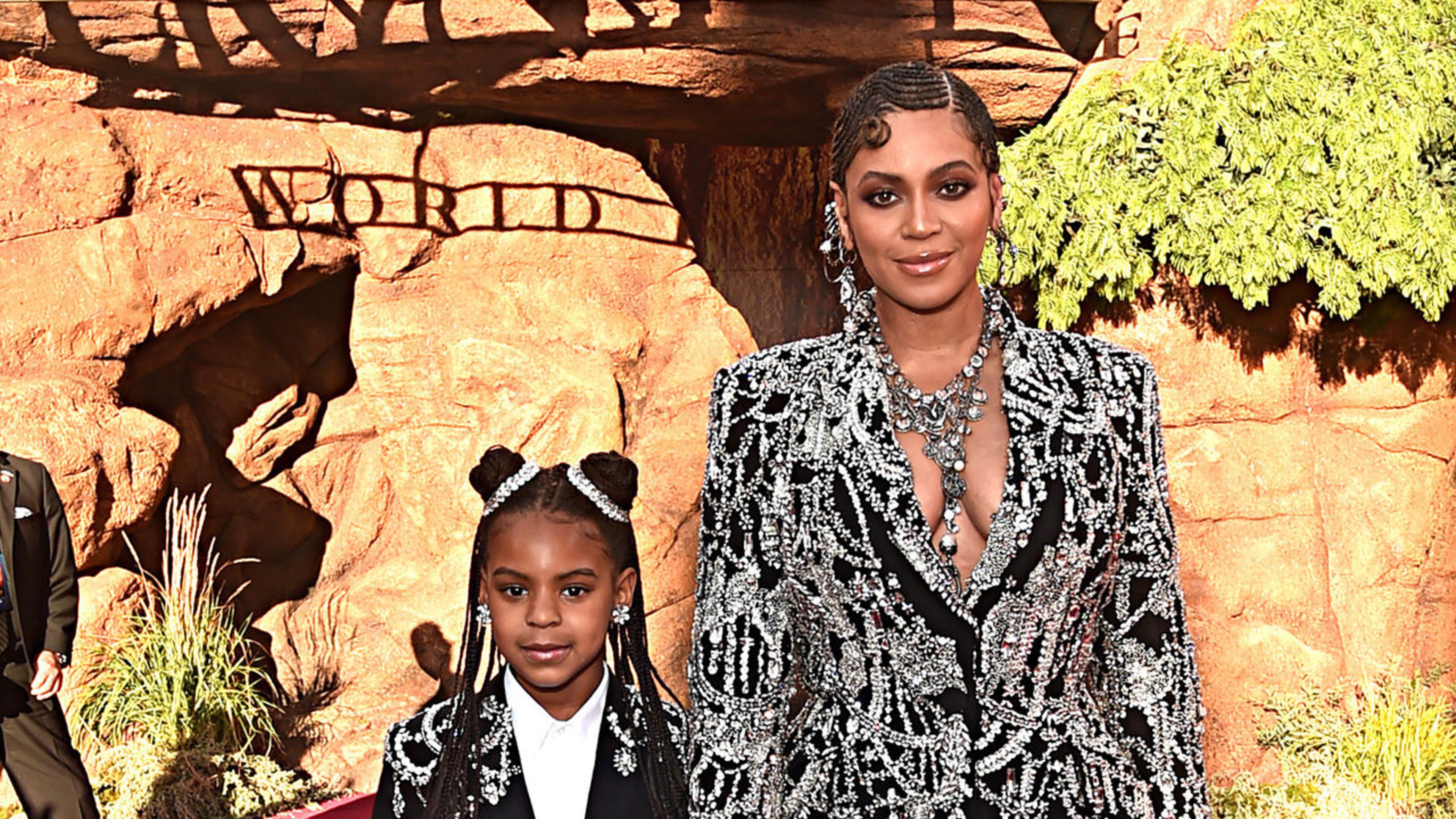 Blue Ivy Carter (L) and her mother, Beyonce, attend the World Premiere of "The Lion King." Blue appears in the music video for Beyonce's song "Spirit."