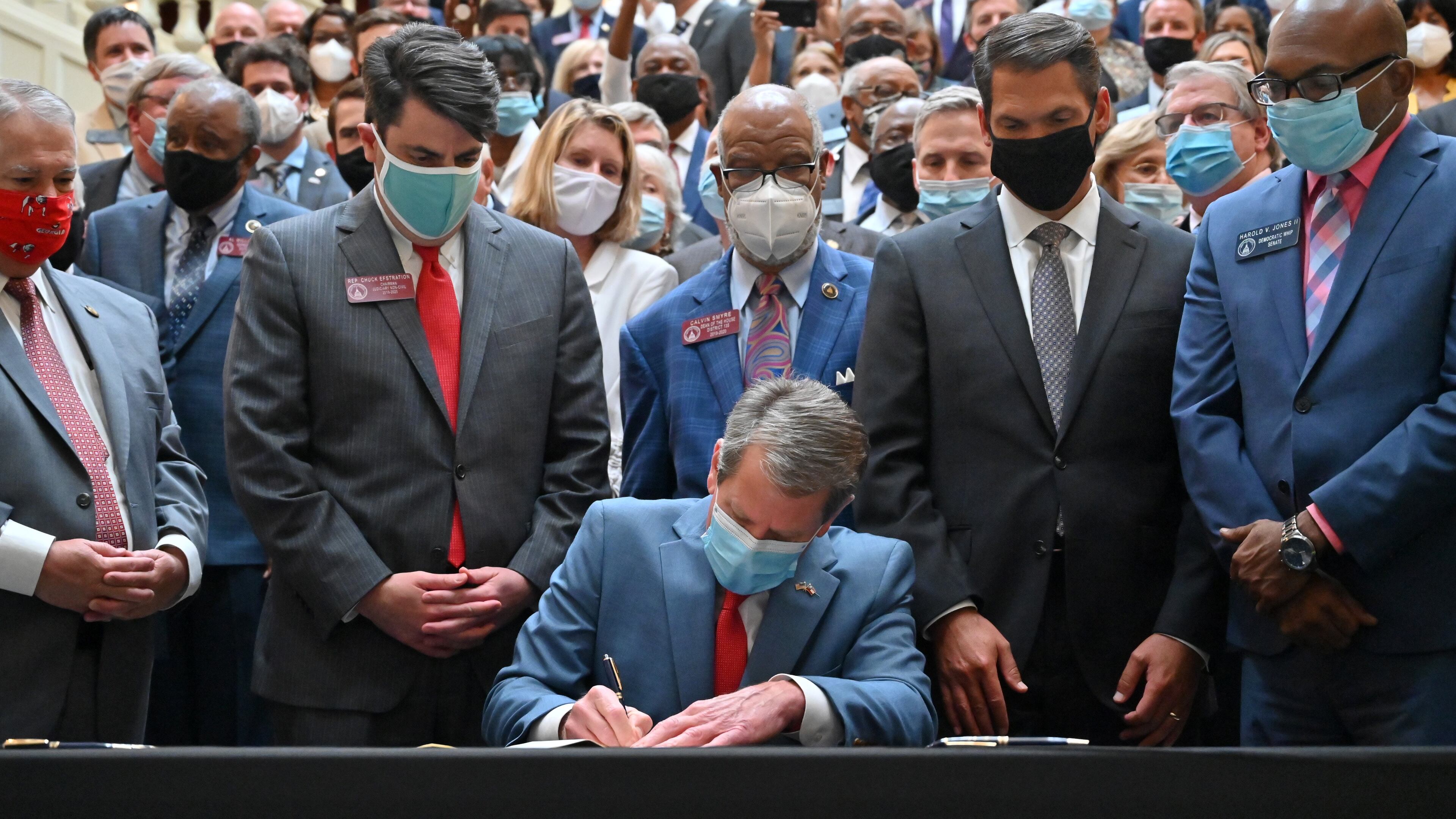 June 26, 2020 Atlanta - Gov. Brian Kemp signs HB 426, hate-crimes legislation, into law on the last day of the legislative session at Georgia State Capitol on Friday, June 26, 2020. Gov. Brian Kemp signed hate-crimes legislation into law on Friday after state lawmakers brokered a compromise over the proposal after 16 years of debate over whether to extend protections to people who are targeted because of biases. (Hyosub Shin / Hyosub.Shin@ajc.com)