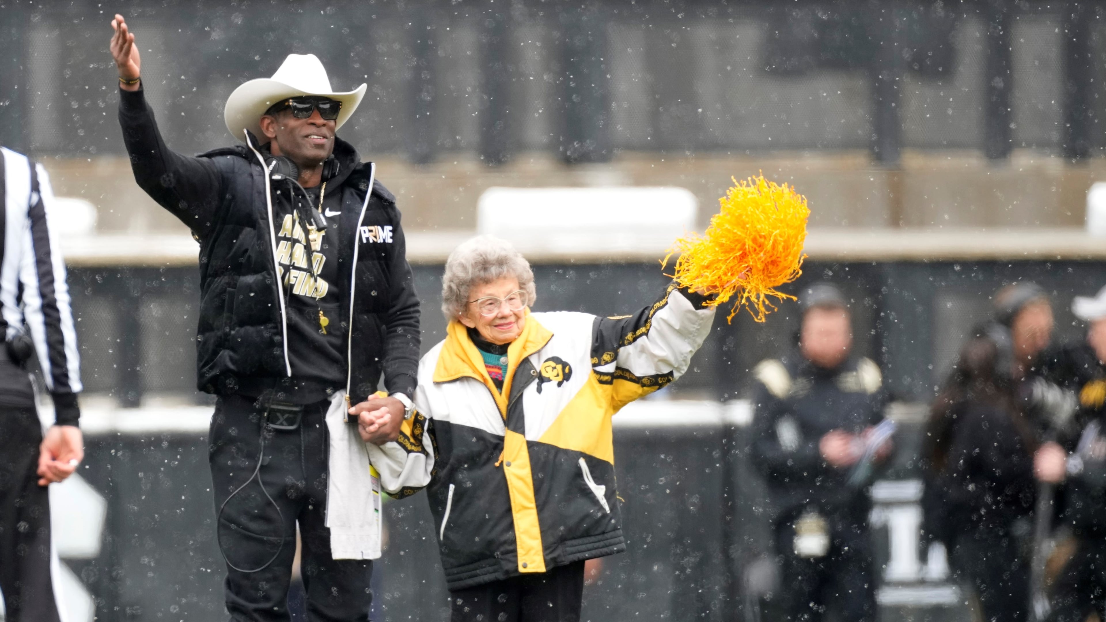 Colorado coach Deion Sanders with longtime supporter Peggy Coppom prior to the spring game in April. Coppom, 98, said she's excited about Colorado's return to the Big 12 in 2024. She has attended Colorado football games since 1940.