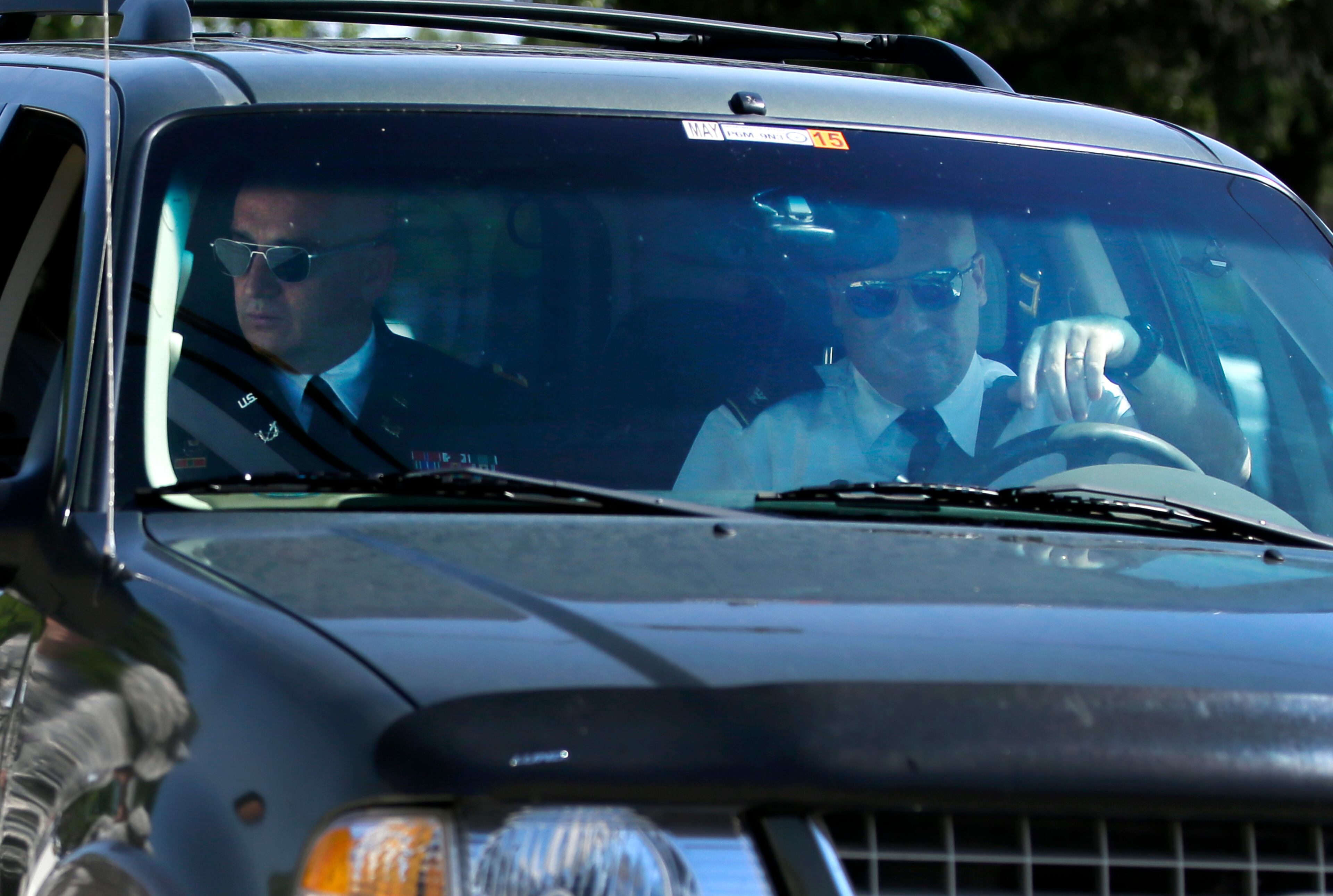 U.S. Army Col. Mike Mulligan, left, the lead prosecutor and U.S. Army Col. Steven Henricks, driving, arrive at the Lawrence H. WIlliams Judicial Center for a pretrial hearing, Tuesday, July 9, 2013, in Fort Hood, Texas. Jury selection is set to start Tuesday in the long-awaited murder trial of Army psychiatrist Maj. Nidal Hasan, accused of opening fire with a semi-automatic gun at Fort Hood nearly four years ago.