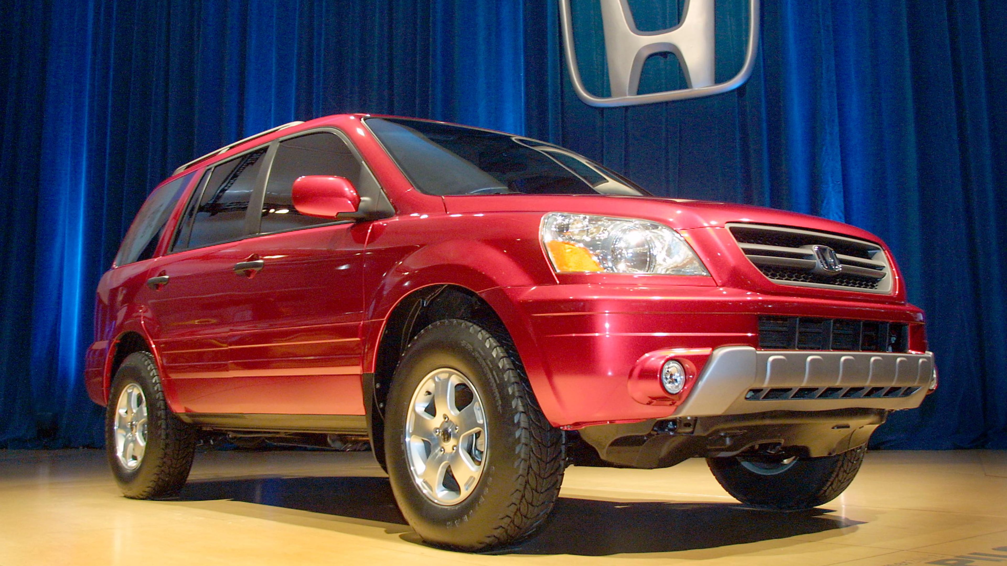 A man attempting to steal a Honda Pilot SUV got a surprise when the woman who owned the vehicle dragged him out of the driver's seat and pinned him to the ground.