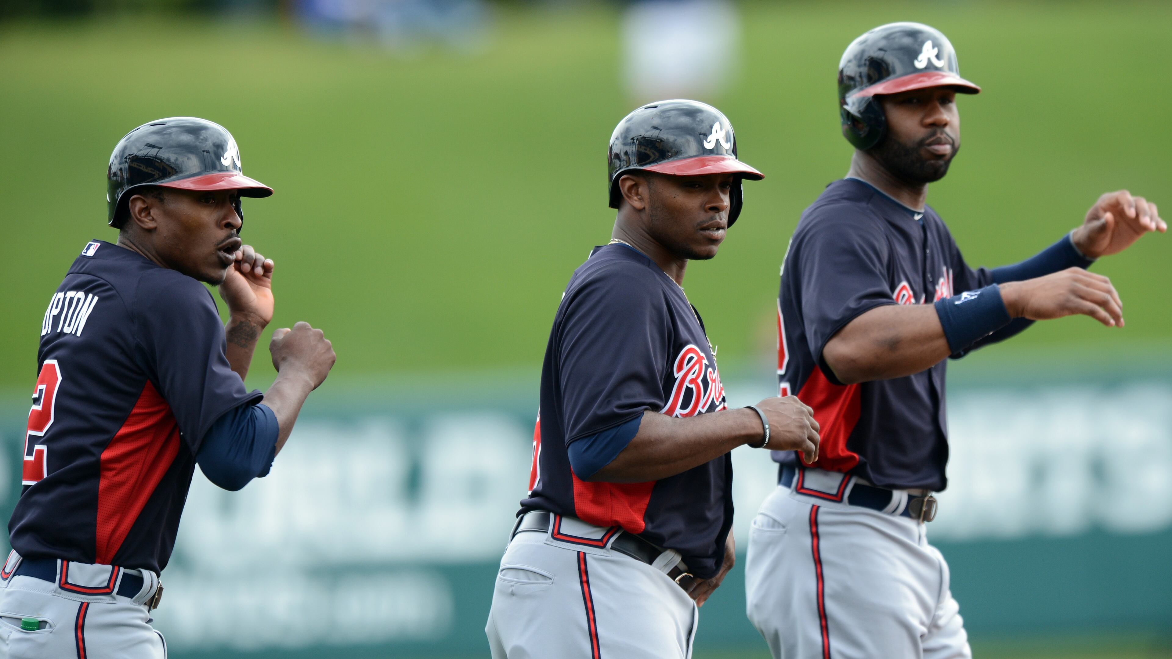 Braves outfielders (from left) B.J. Upton, Justin Upton and Jason Heyward react to a foul ball.