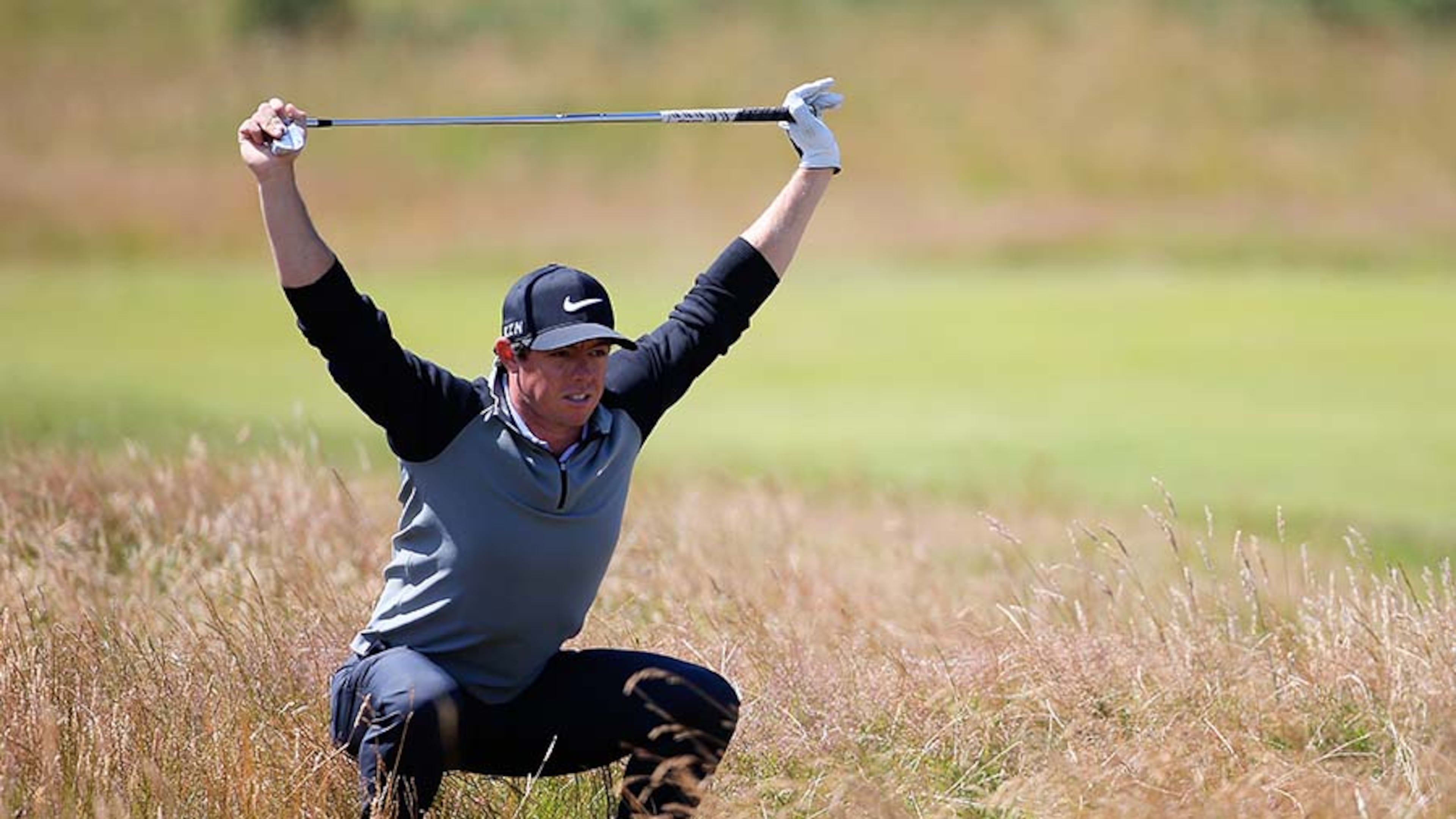 Rory McIlroy of Northern Ireland stretches during a practice round prior to the start of The 143rd Open Championship at Royal Liverpool on July 15, 2014 in Hoylake, England.