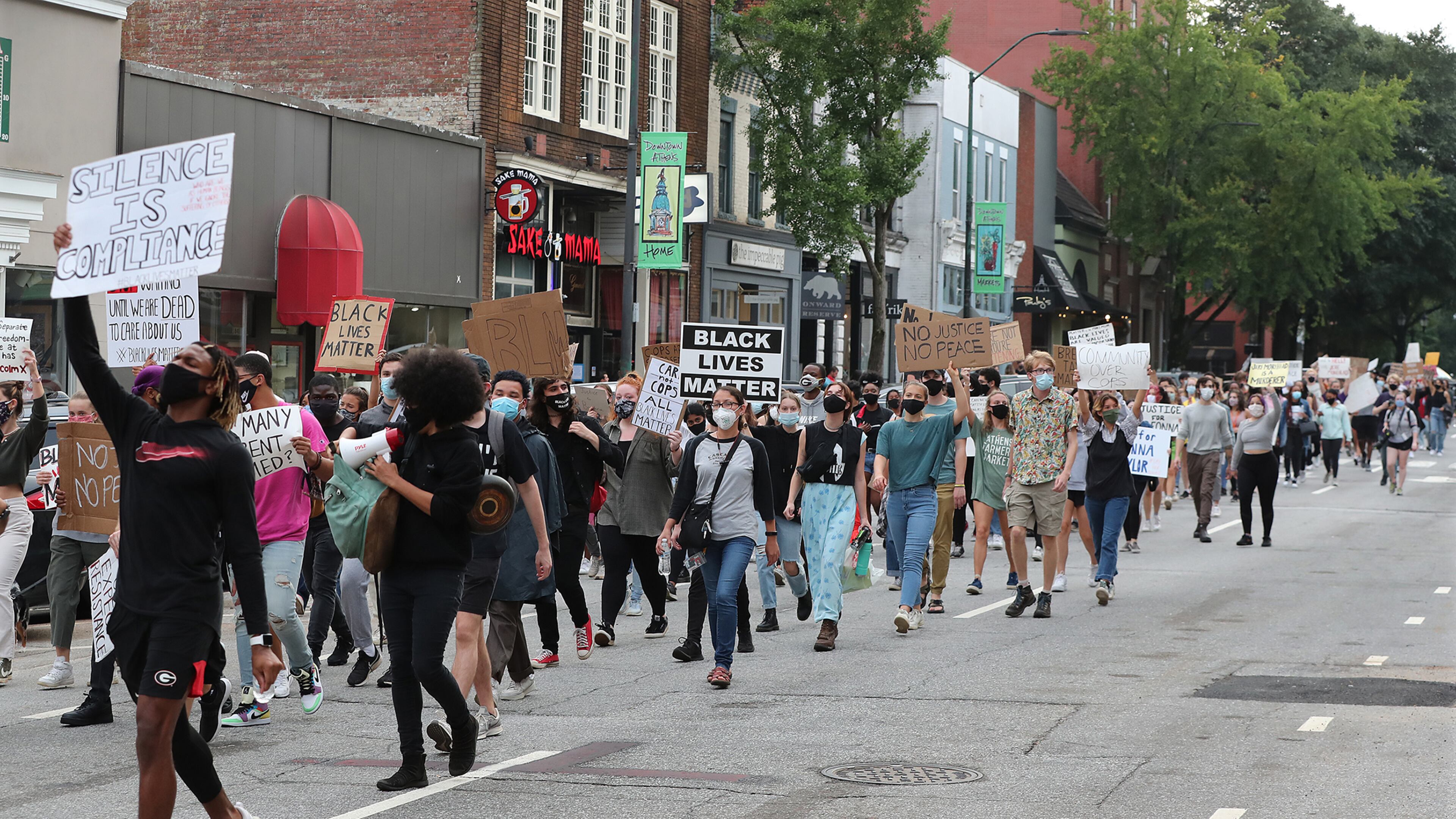 University of Georgia students take to the streets and march down East Clayton Street from the UGA arch during a Black Lives Matter protest in support of Breonna Taylor on Sept. 25 in Athens. (Curtis Compton / Curtis.Compton@ajc.com)