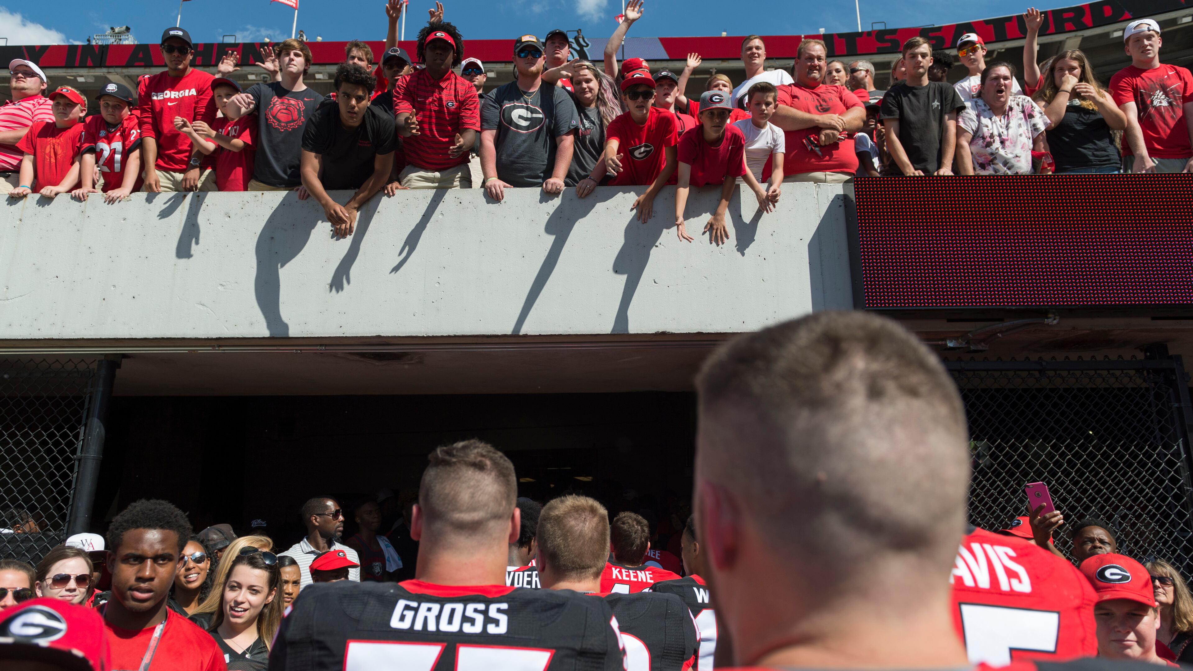 Fans cheer as Georgia players leave the field after the G-Day game in Athens, Georgia, on Saturday, April 22, 2017. The Red team defeated the Black team 25-22. (DAVID BARNES / AJC file)