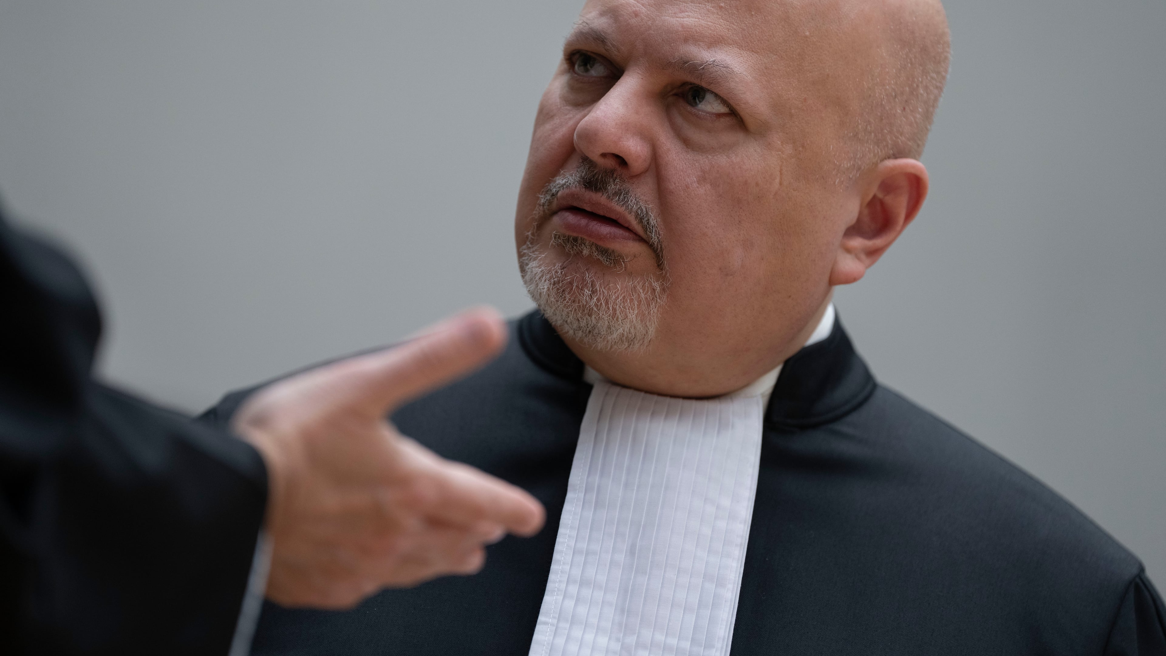 FILE - Chief Prosecutor Karim Khan talks before convening the International Criminal Court (ICC) in The Hague, Netherlands, March 14, 2025. (AP Photo/Peter Dejong, Pool, File)
