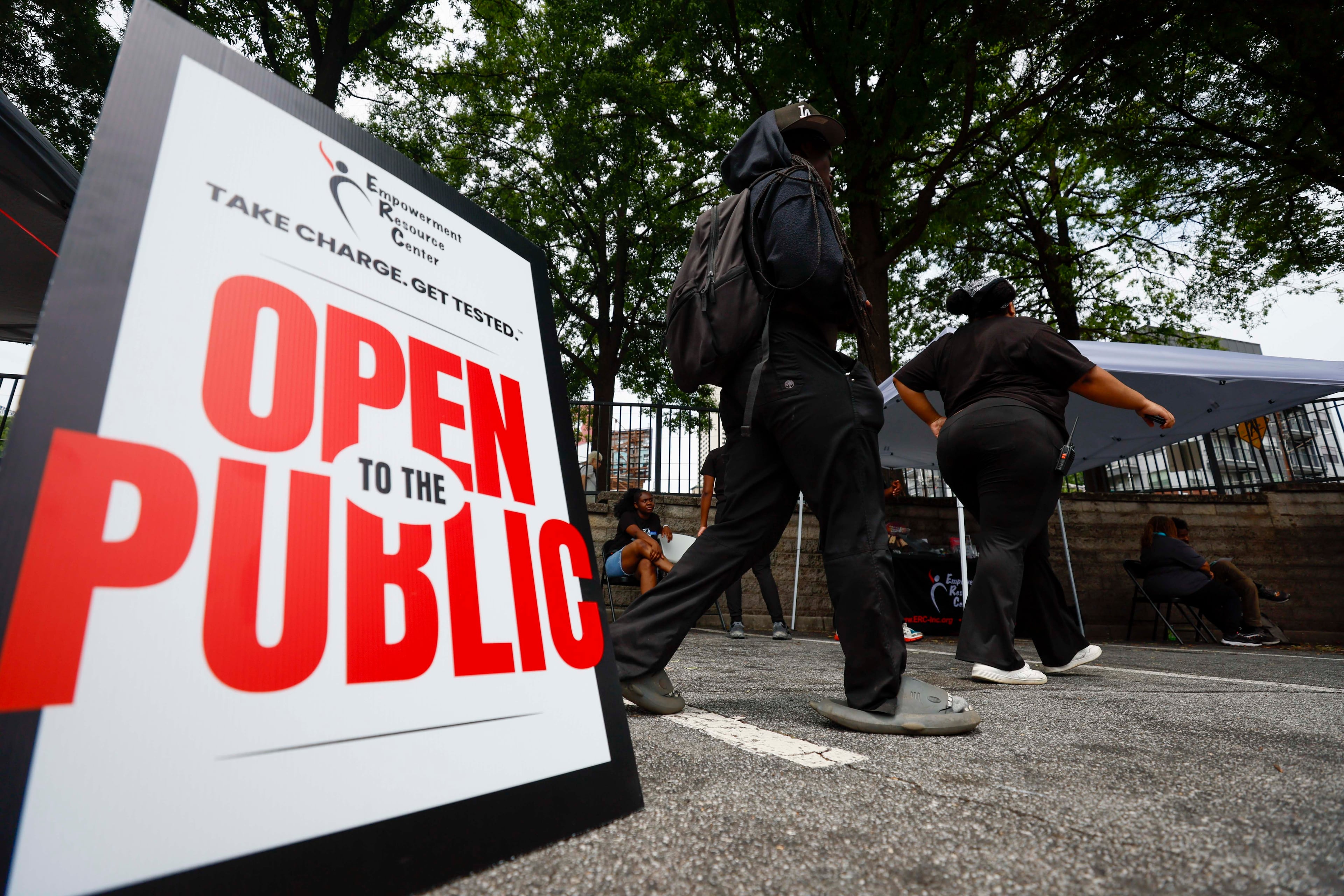 Staff from the Empowerment Resource Center, in collaboration with Walgreens and Streetz 94.5, participate in an HIV testing event on Wednesday, June 25, 2025. Funding changes have affected metro Atlanta organizations and communities. (Miguel Martinez/AJC)