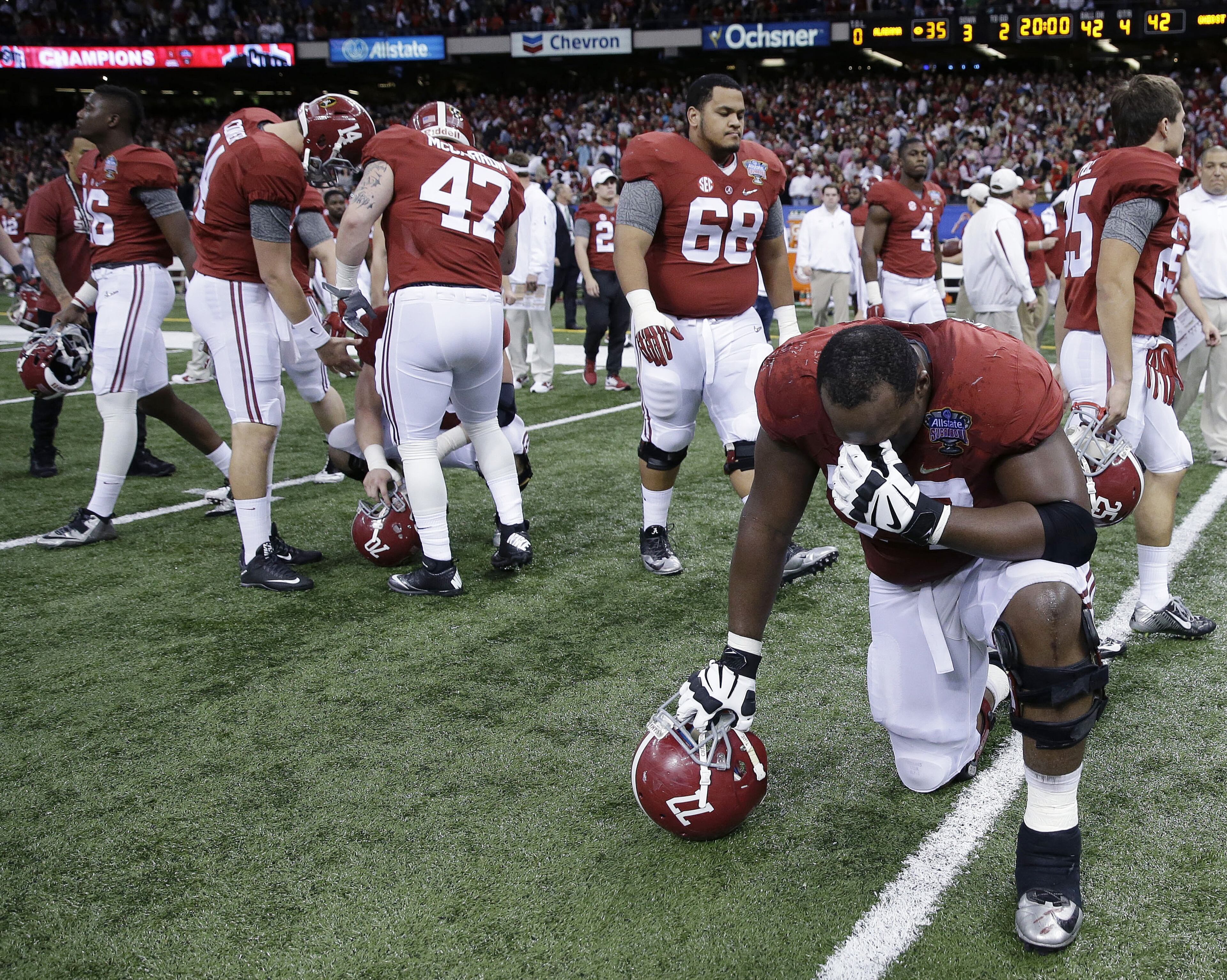 Alabama players take the field after the Sugar Bowl NCAA college football playoff semifinal game against Ohio State, Thursday, Jan. 1, 2015, in New Orleans. Ohio State won 42-35. (AP Photo/Brynn Anderson)