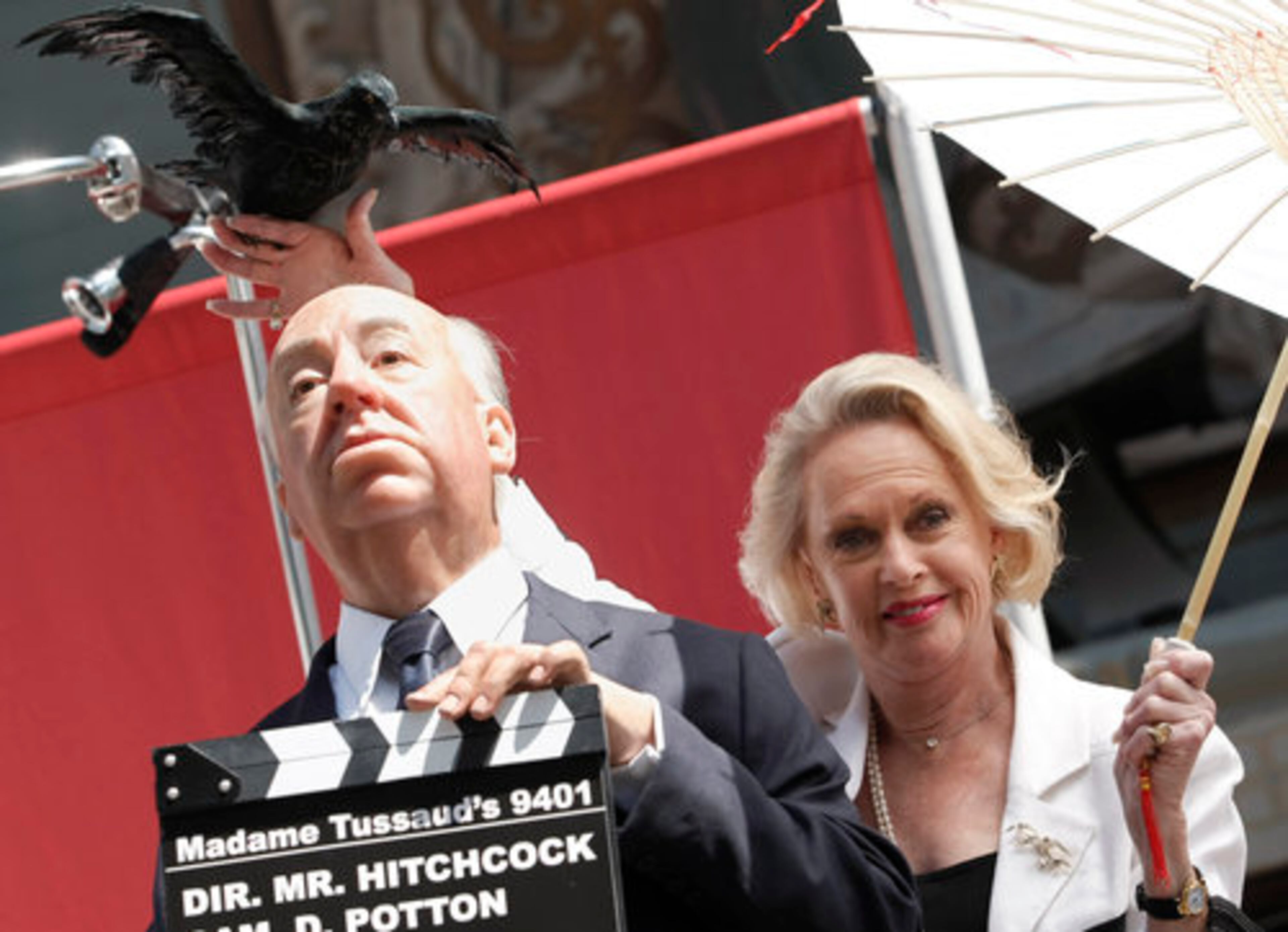 SCARY FIGURE: Actress Tippi Hendren, poses with a wax figure of the late director Alfred Hitchcock in Los Angeles on Wednesday. Madame Tussauds Hollywood is scheduled to open to the public on Aug. 1.