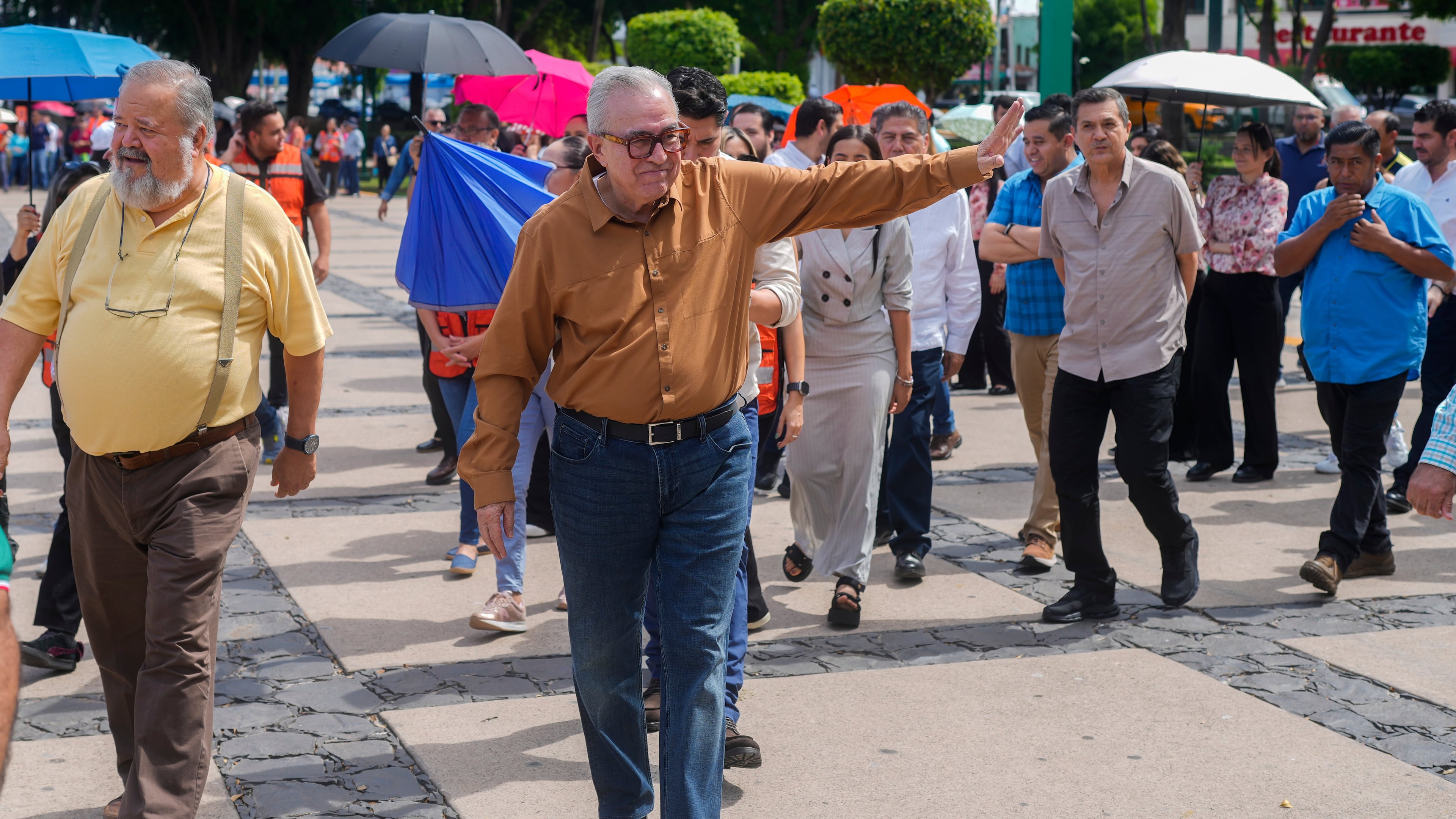 FILE - Sinaloa state Gov. Ruben Rocha waves as he takes part in an annual earthquake drill in Culiacan, Mexico, Sept. 19, 2024. (AP Photo/Eduardo Verdugo, File)