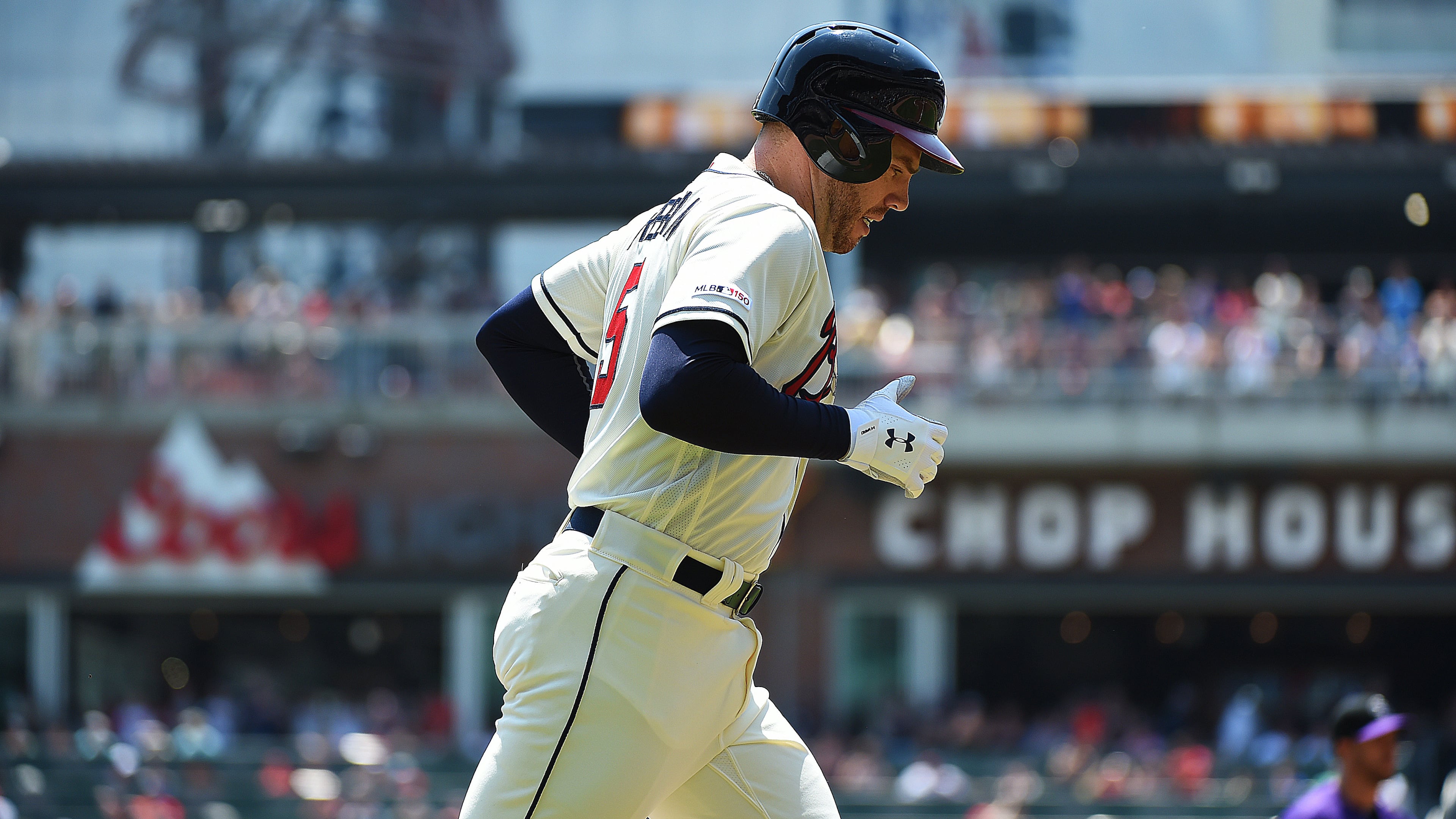 Braves first baseman Freddie trots home after hitting a home run April 28, 2019, against the Colorado Rockies at SunTrust Park in Atlanta.