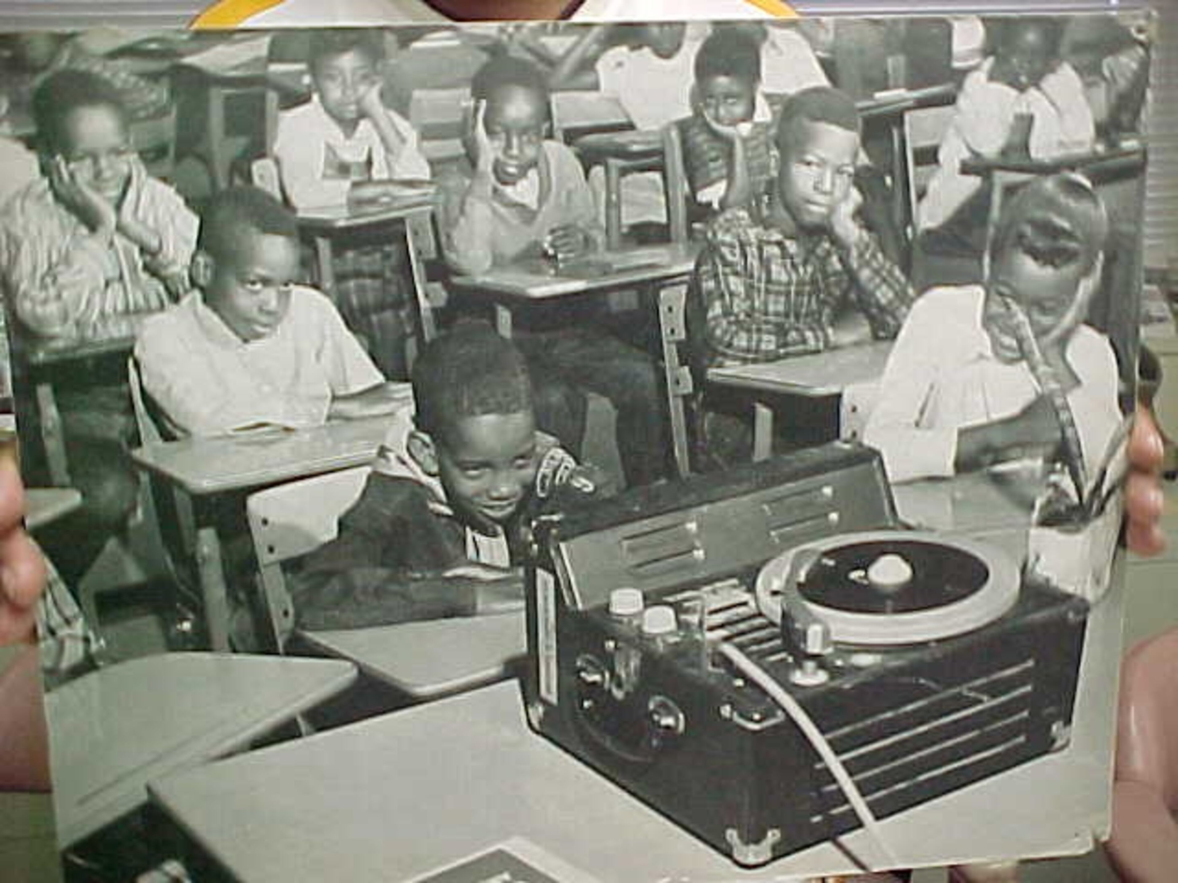 Before desegregation came to Atlanta schools in the 1960s, students such as these listening to music on an old-fashioned phonograph record player attended all-black schools. Photo from Atlanta Public Schools archives