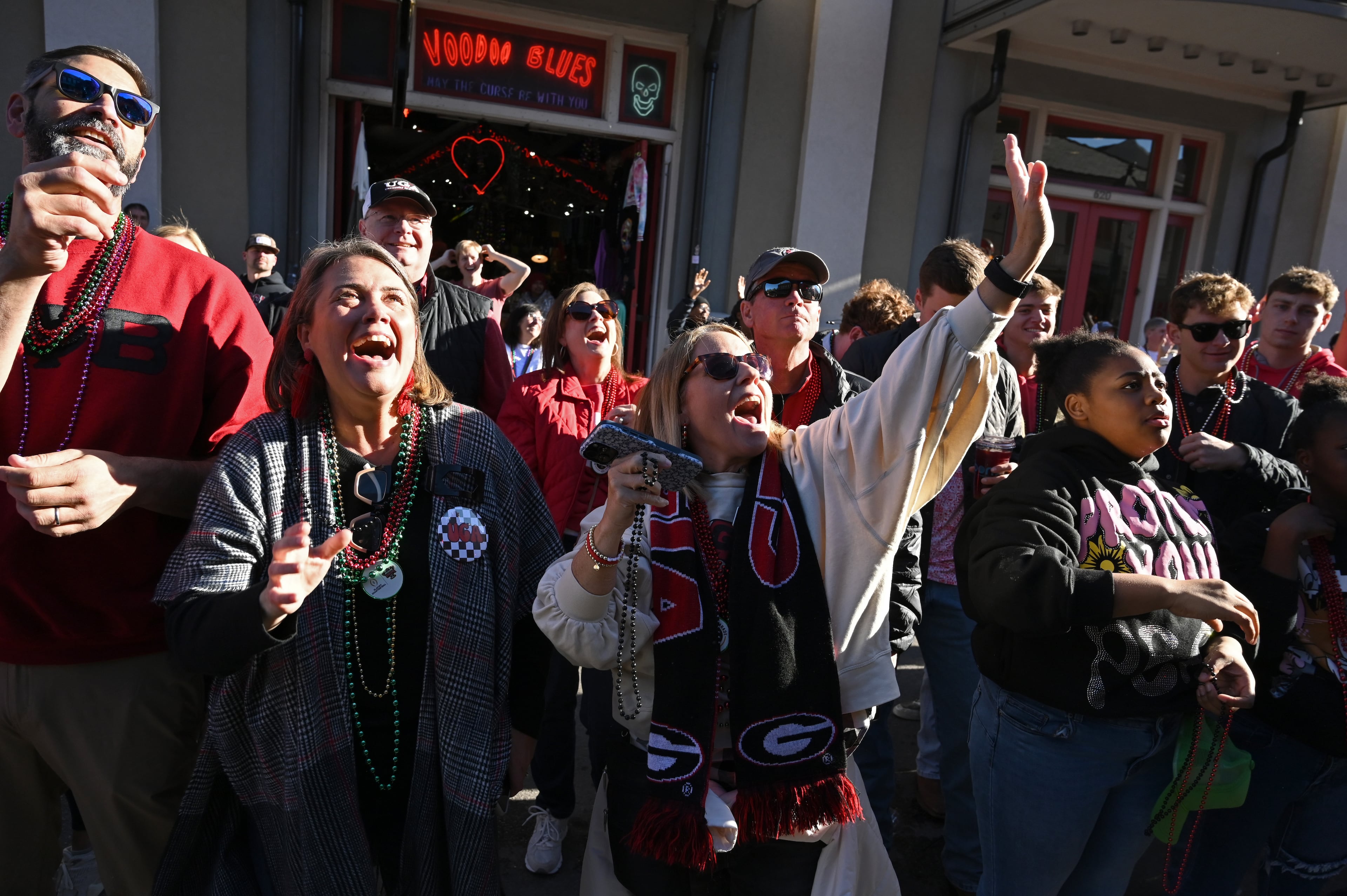 Georgia fans cheer as Georgia float travels down Decatur Street during the Allstate Sugar Bowl New Year’s Eve Parade, Wednesday, December 31, 2025, in New Orleans. (Hyosub Shin/AJC)