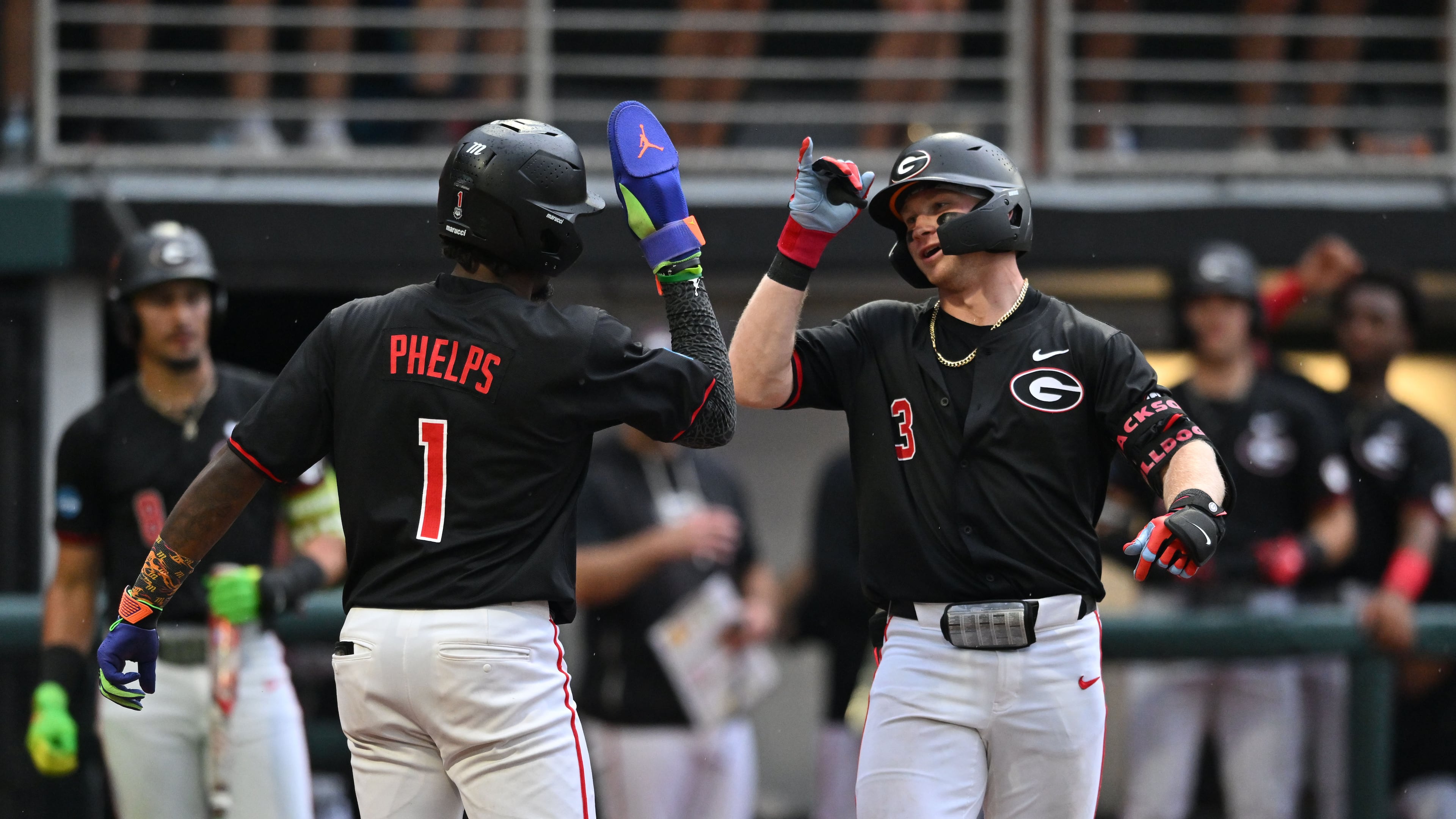 Georgia catcher Daniel Jackson (3) celebrates with Georgia infielder Tre Phelps (1) after hitting a solo home run during the fifth inning of their NCAA Regional game at Foley Field, Friday, May 29, 2026, in Athens. (Hyosub Shin/AJC)