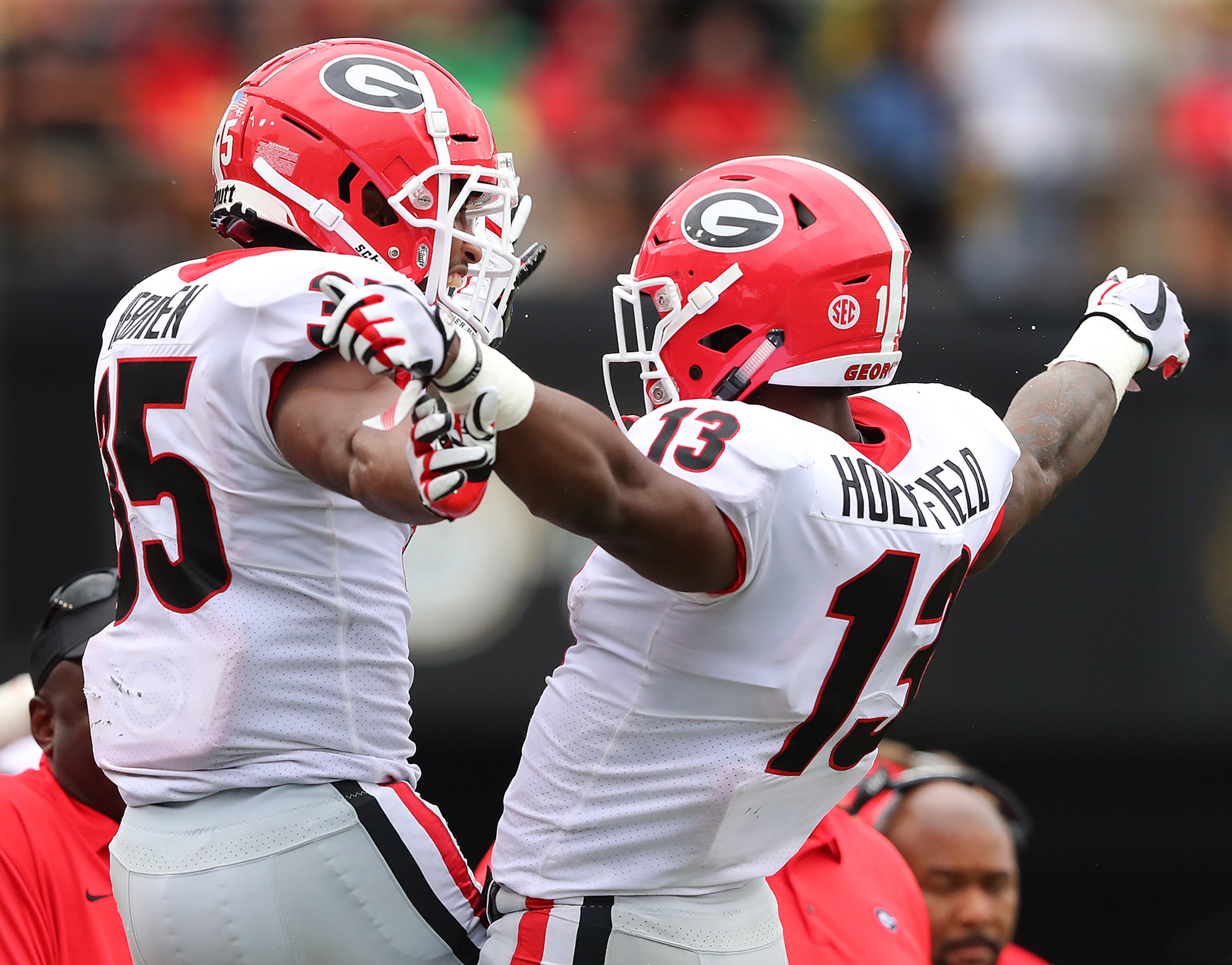 October 7, 2017 Nashville: Georgia tailback Elijah Holyfield celebrates his touchdown run with Brian Herrien for a 45-7 lead over Vanderbilt during the fourth quarter in a NCAA college football game on Saturday, October 7, 2017, in Nashville. Curtis Compton/ccompton@ajc.com
