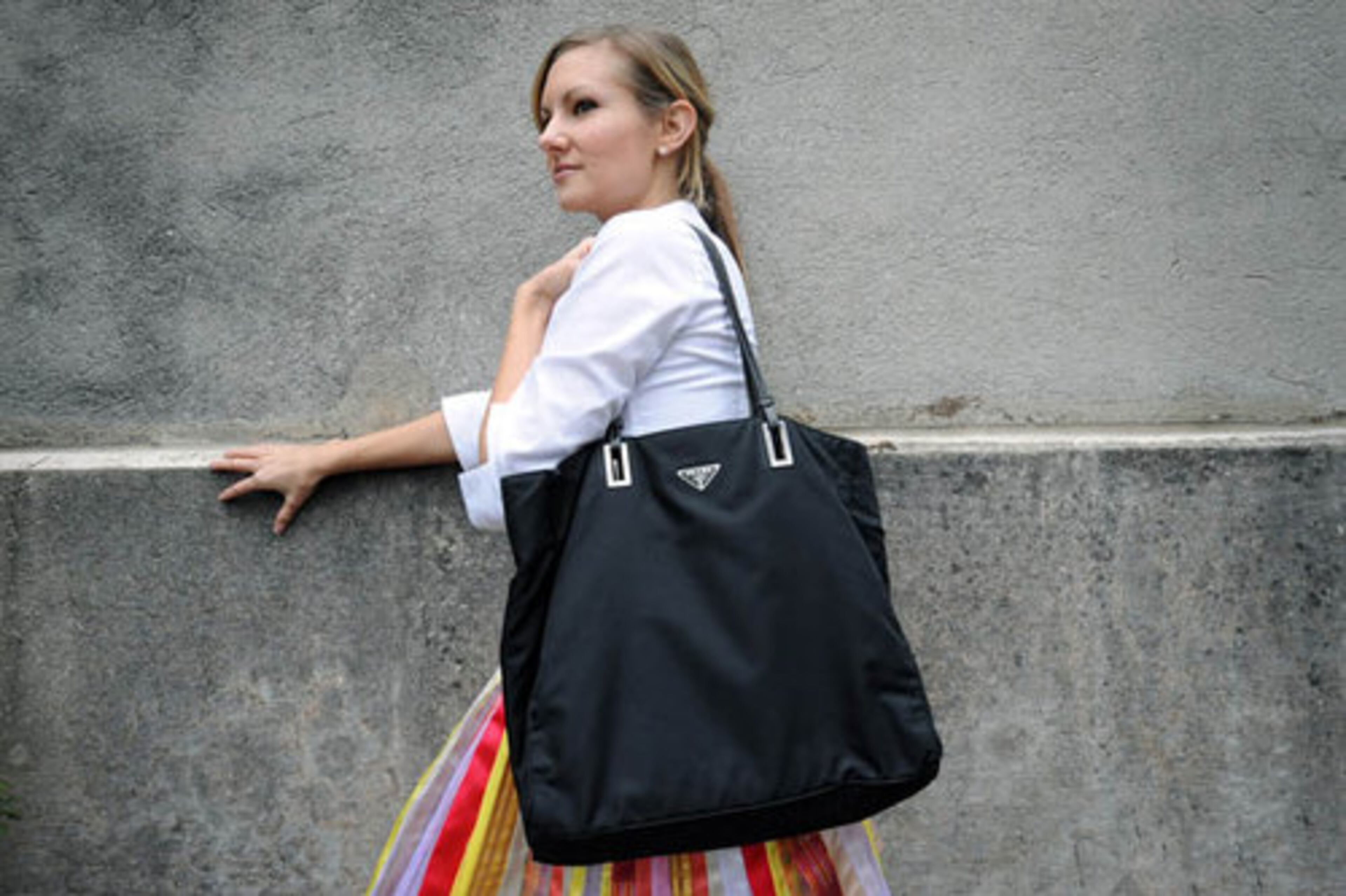 BIGGEST SPLURGE: "My Prada bag --- basic black nylon --- that I have turned into a computer bag, a purse and my everything bag."