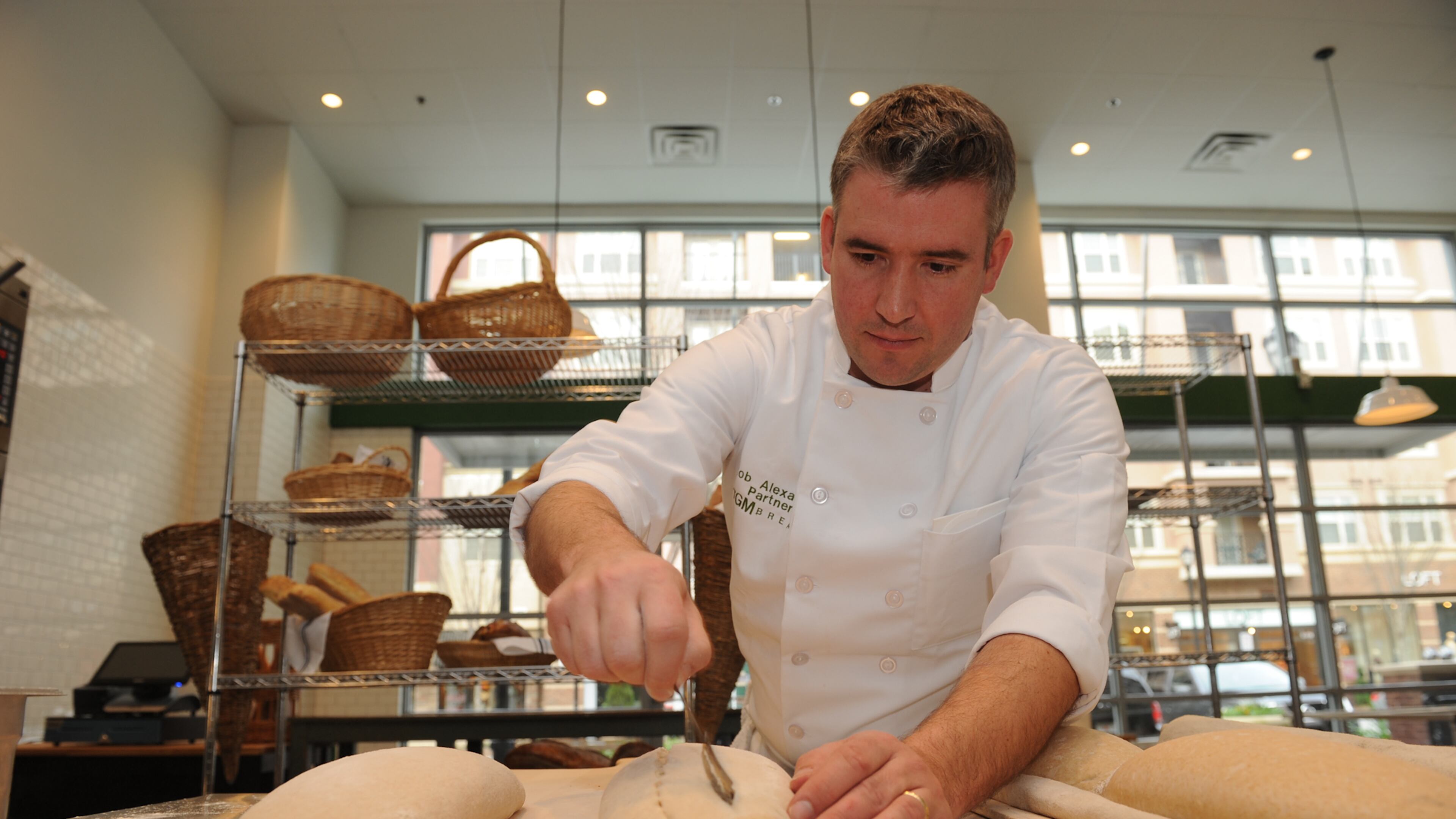 TGM Bread master baker Rob Alexander works at the Emory Point space. (BECKYSTEIN.COM)